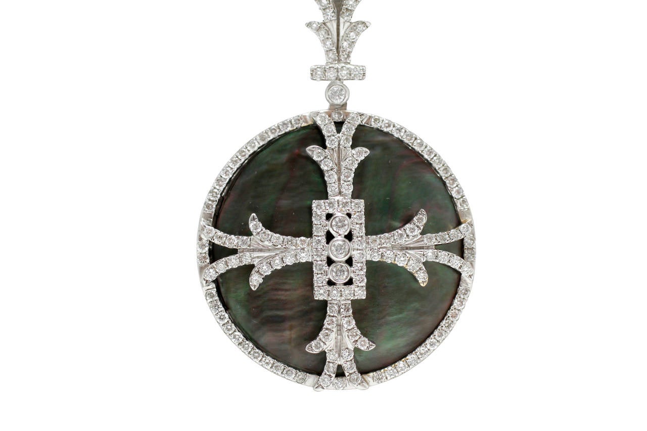 This Burdeen's Jewelry most unique & gorgeous 18K White Gold, Mother-of-Pearl & Diamond Maltese Cross Pendant ( 157 diamonds = 1.11ctw )...is absolutely fabulous and can be worn with jeans & your dressiest clothes as well! This pendant is hanging