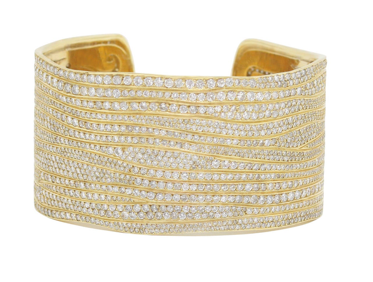 This Burdeen's Jewelry dazzling 18K Yellow Gold & Diamond Cuff Bracelet, has over 2,000 brilliant round white diamonds, that are handset into this delicate designed exterior of the cuff. The interior of the cuff bracelet continues the moving bright