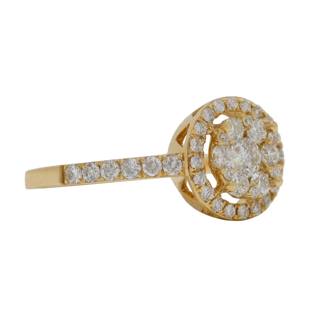 This absolutely gorgeous & elegant 18K Yellow Gold Ring, from Burdeen's Jewelry, has a center cluster of round diamonds and a round halo of diamonds.
The round brilliant cut diamonds are prong-set with mutual prongs in the round cluster. Four