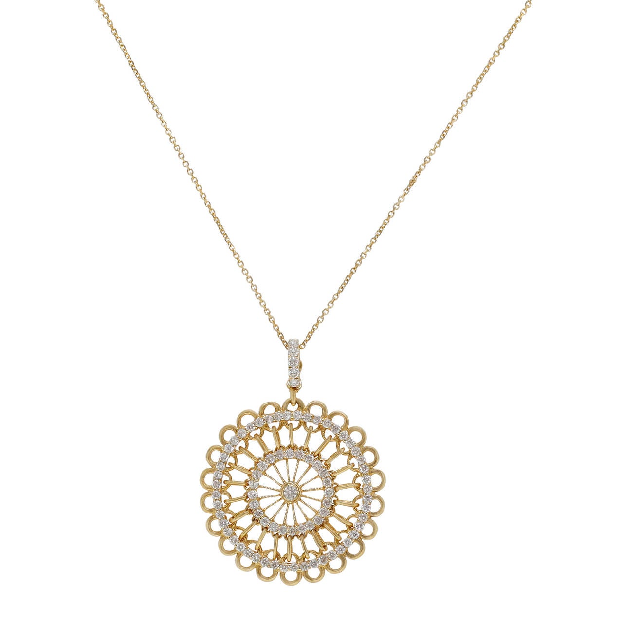 This Burdeen's Jewelry Spectacular 14K Yellow Gold Round Spindle Diamond Pendant...has faceted round diamonds that are prong-set in 2 circles, covering the circumference of the pendant ( 2.08ctw.). A center larger diamond is bezel-set, and the bail