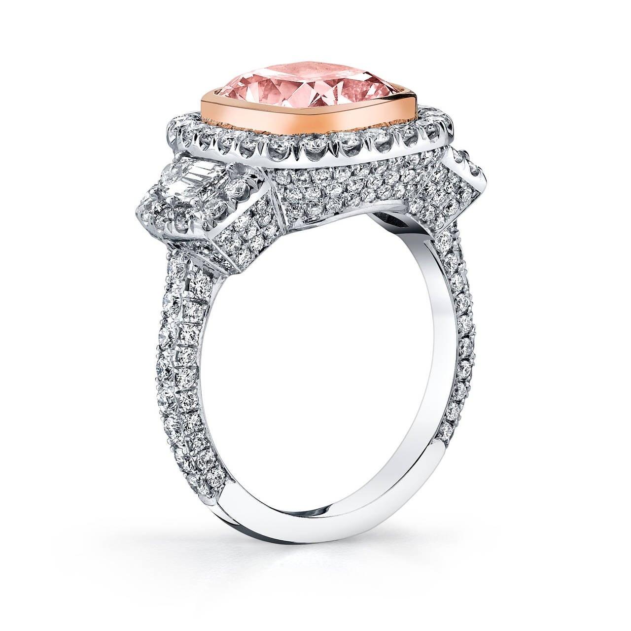 This most stunning piece from Burdeen's Jewelry...is a 3 Stone Platinum & 18K Rose Gold Ring. The ring has a center Light Pink Cushion Diamond (4.01 ctw & GIA Certified), 2 Cadillac Trapezoid side stones (.48 ctw), a pave diamond halo, a pave