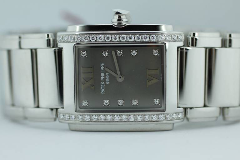 Brand: Patek Philippe
Model: Twenty-4
Model Number: 4910/10A
Serial number: 4071855
Gender: Lady's
Movement: Quartz
Case size: 25mm X 30mm
Case material: Stainless steel
Dial: Gray
Crystal: Sapphire
