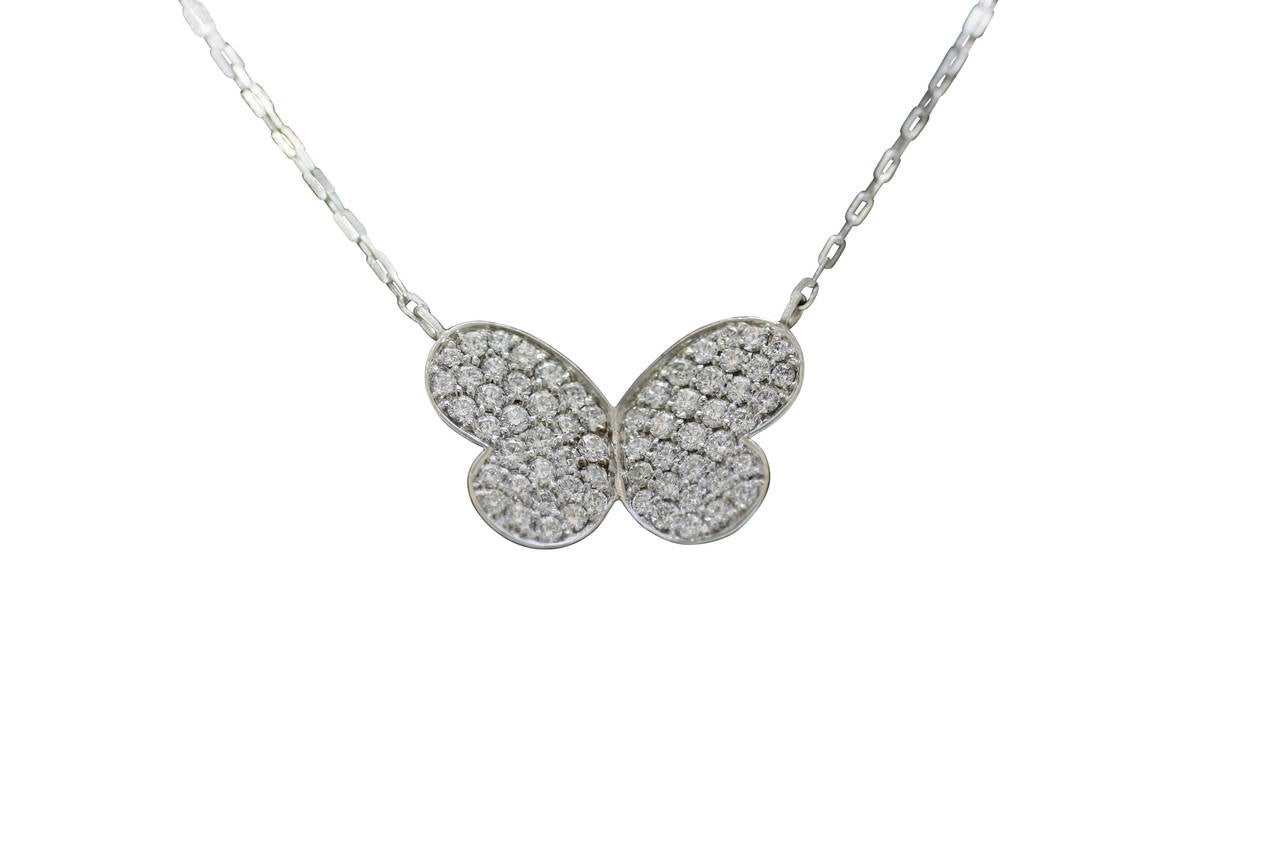 18kt white gold and diamond pave butterfly pendant.