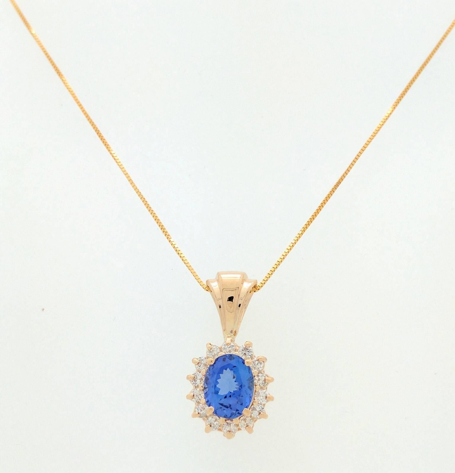 You are viewing a stunning ladies tanzanite & diamond pendant necklace.  This necklace is crafted from 14k yellow gold and weighs 5.2 grams. The pendant features one 1.50ct natural oval shaped tanzanite and fourteen .03 to .04ct round natural