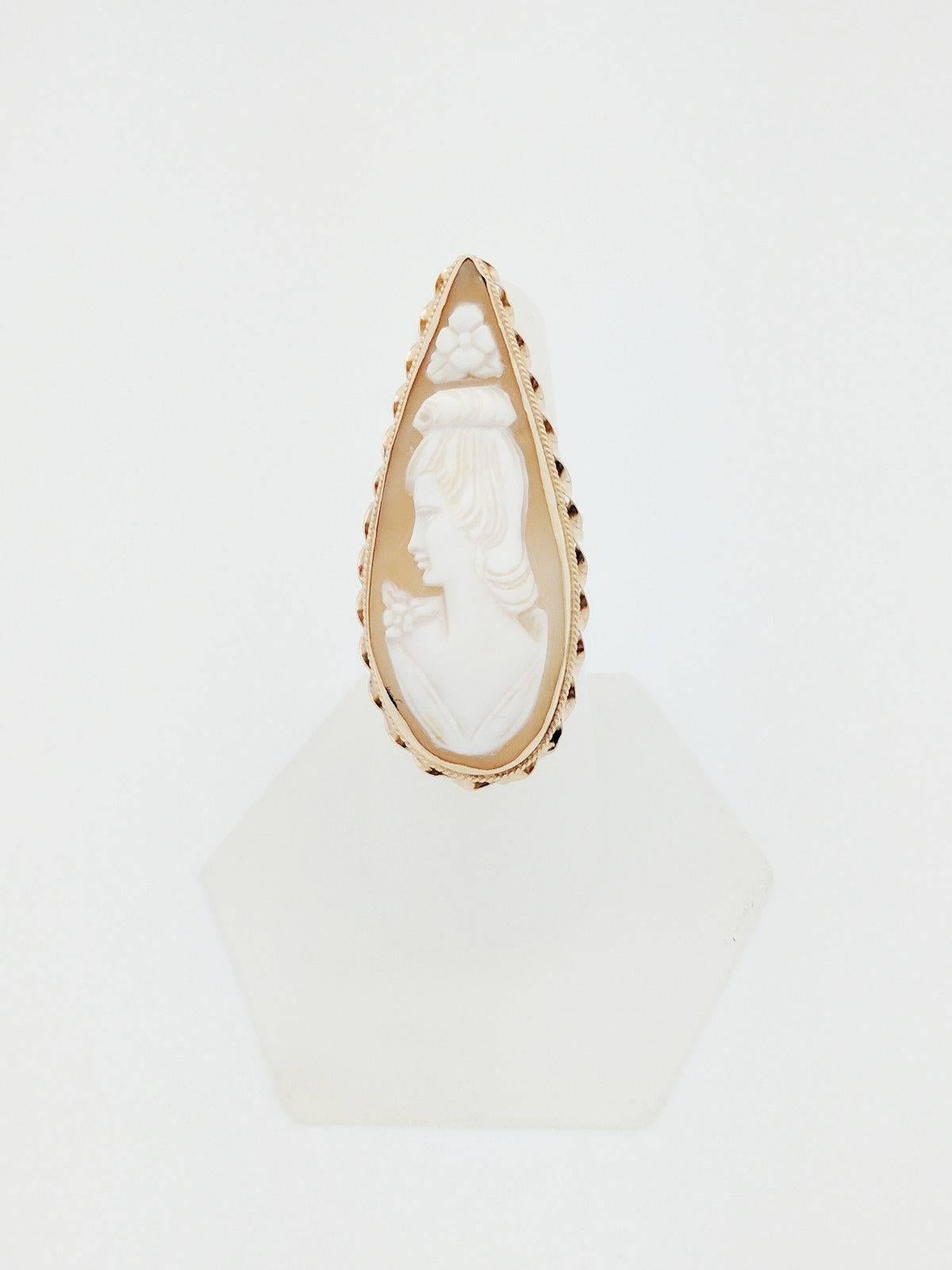 You are viewing a beautiful vintage ladies cameo ring. Any woman would love to add this piece to their collection!

This ring is crafted from 14k yellow gold and weighs 9.2 grams.  It features one pear shaped hand carved cameo. The cameo measures