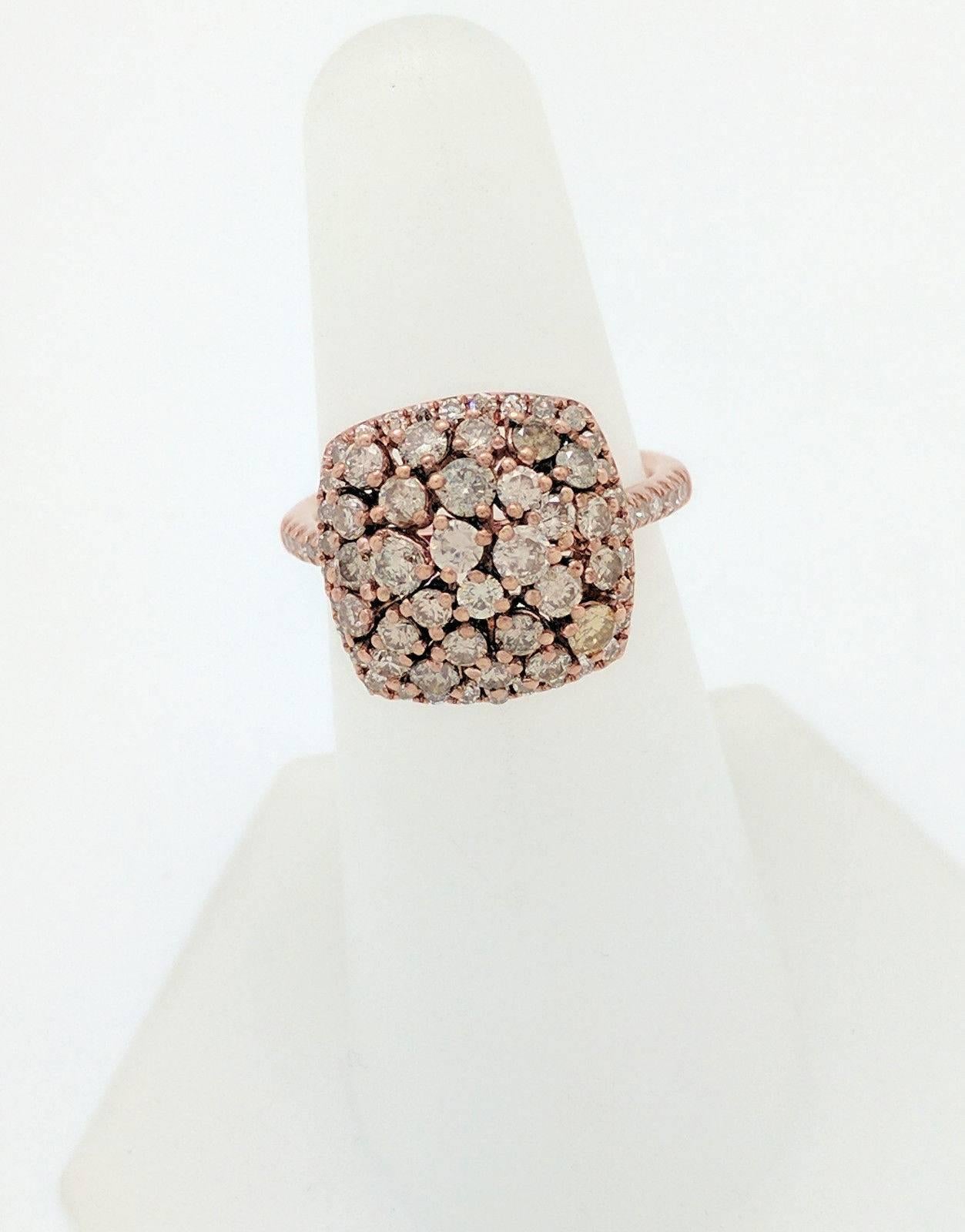 You are viewing a beautiful Champagne Diamond Ring. This ring is crafted from 14k rose gold and weigh 6 grams. This ring features 59 round natural champagne diamonds for an estimated 2 carats total weight. This ring is currently a size 6.5, and can