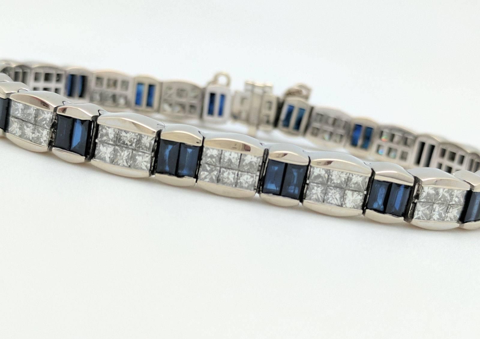 You are viewing a Beautiful Diamond & Sapphire Tennis Bracelet. This bracelet is crafted from 18k white gold, measures 6mm in width and weighs 33.9 grams. It features 94 .05ct princess cut natural diamonds, for an estimated 4.7 carats of