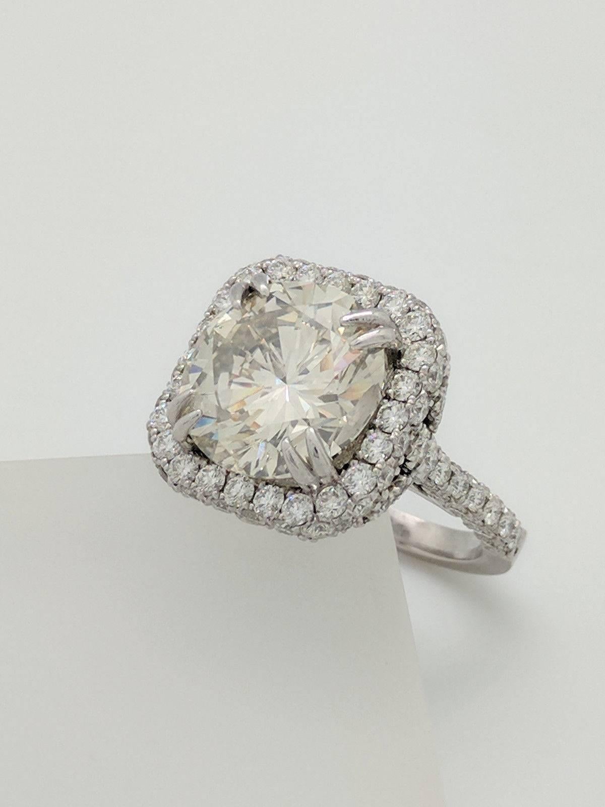 10.02ct Natural Round Diamond in Custom Platinum Engagement Ring Setting 3.60cts.
GIA Certified: I1 Clarity ~ L Color
 
You are viewing a beautiful 10.02ct natural round diamond. This diamond has been certified by GIA and graded as I1 in clarity and