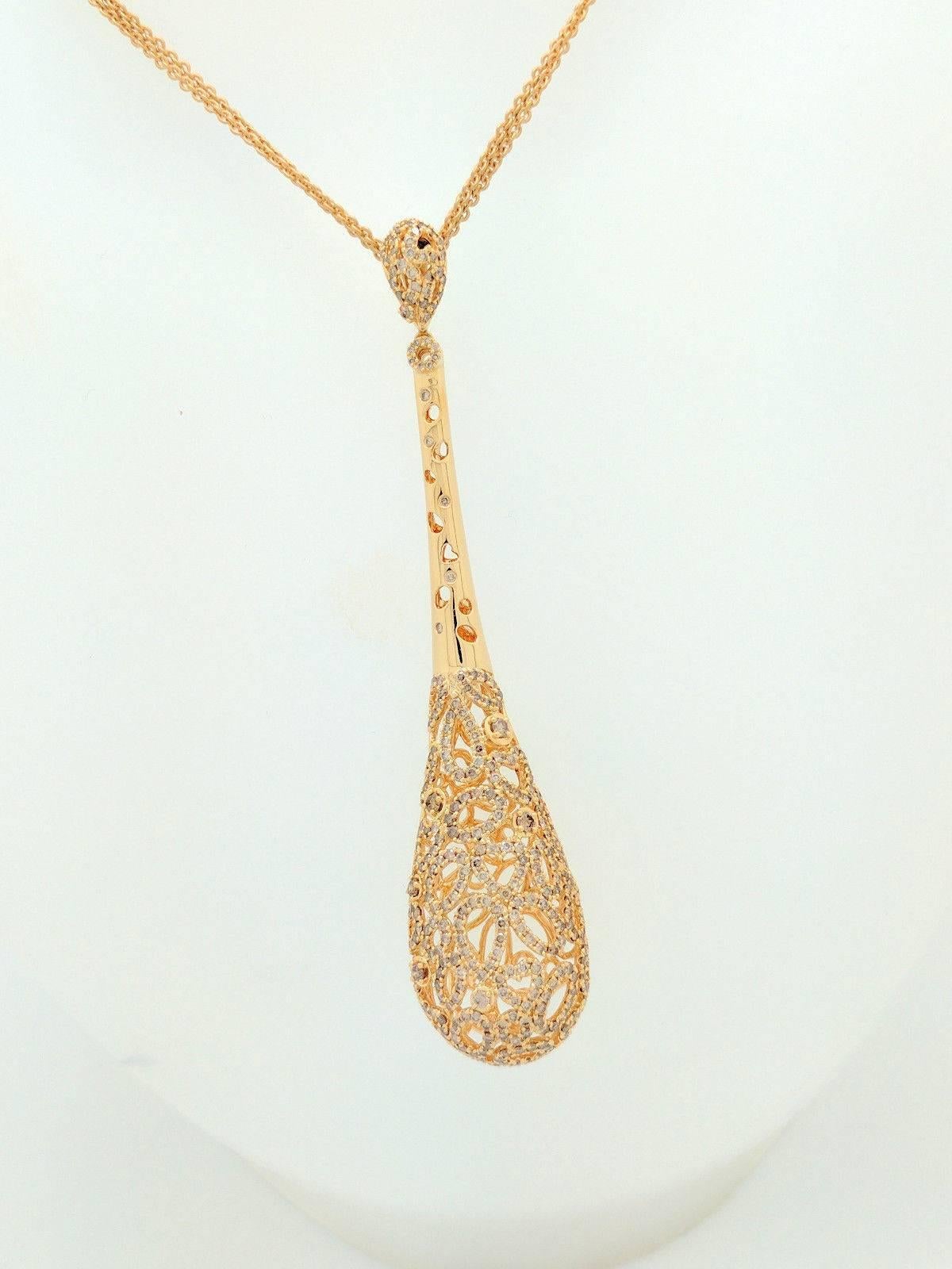 You are viewing an Exquisite Roberto Coin Champagne Diamond Teardrop Pendant Multi-Strand Station Necklace from their Mauresque Collection.

The piece is crafted from 18k yellow gold and weighs 35.3 grams. It features approximately 358 natural round