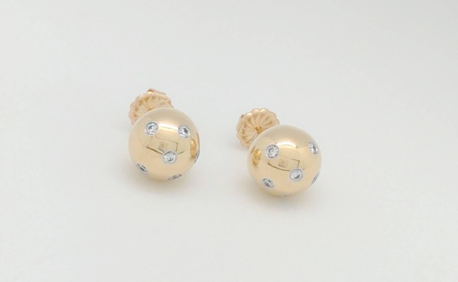 You are viewing a set of authentic Tiffany & Co. .25ctw diamond ball stud earrings from the Etoile Collection.
The earrings are crafted from 18k yellow gold and platinum and weigh 8.9 grams. Each earring features (6) .02ct natural round bezel
