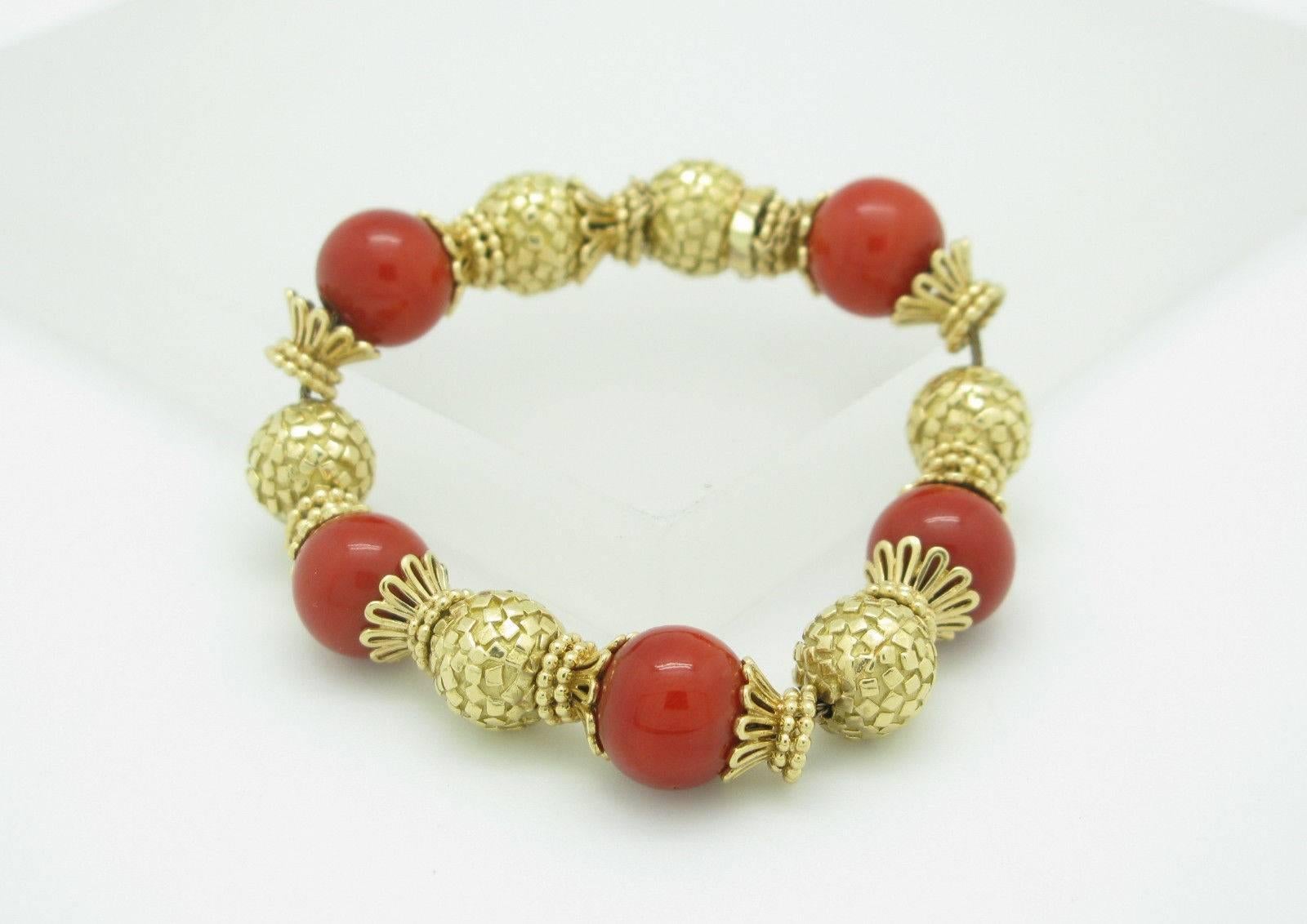 You are viewing a Beautiful Vintage Coral Bracelet.

The bracelet is crafted from 18k yellow gold and weighs 59.6 grams. The bracelet measures 13mm in width and 6.5" in length. It features (5) 13mm round coral beads.

This piece is previously