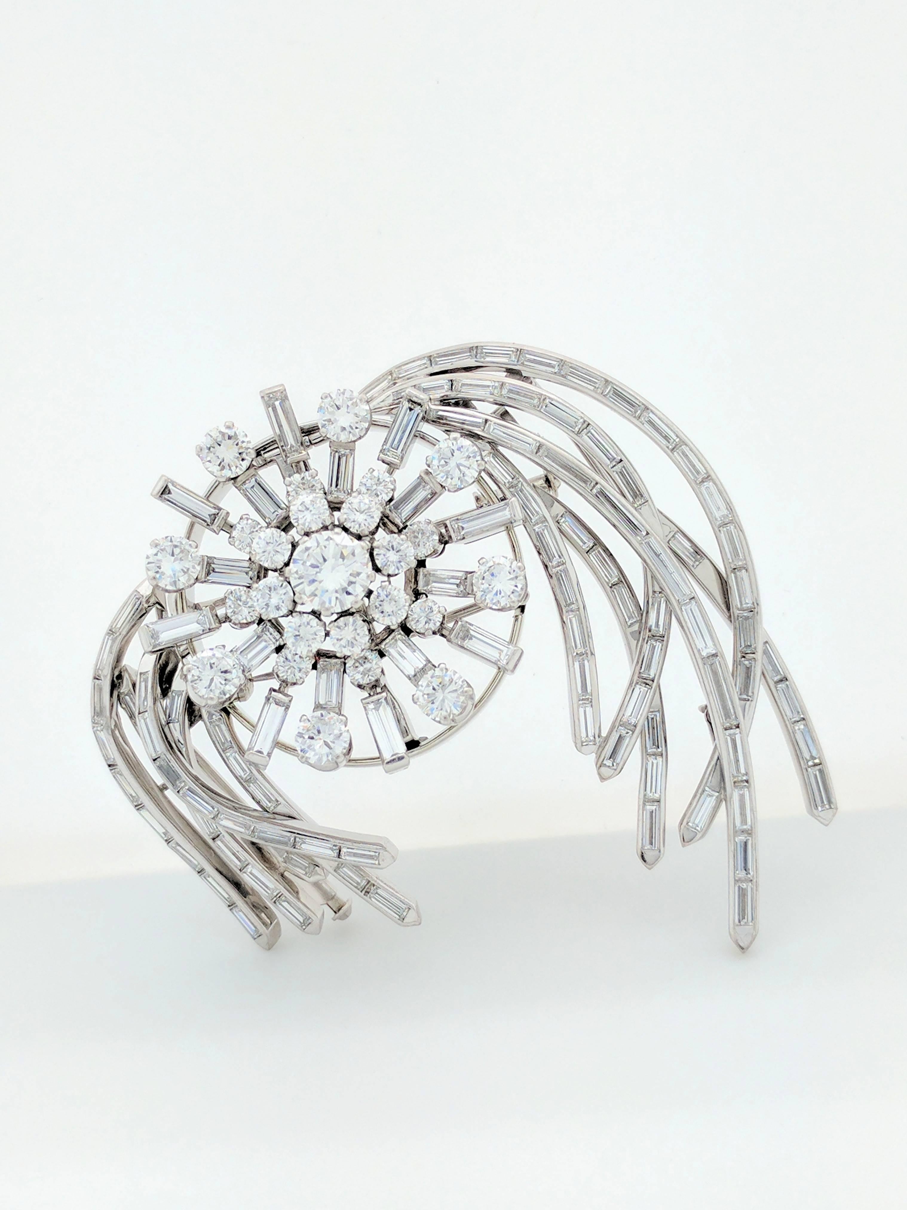 You are viewing a very stunning 1950s brooch/pin. This piece features the following diamonds:

Center: (1) Approx. 1.00ct Round Diamond

2nd Tier: (8) Approx. .10ct Round Diamonds

3rd Tier: (8) Approx. .07ct Round Diamonds

4th Tier: (8) Approx.