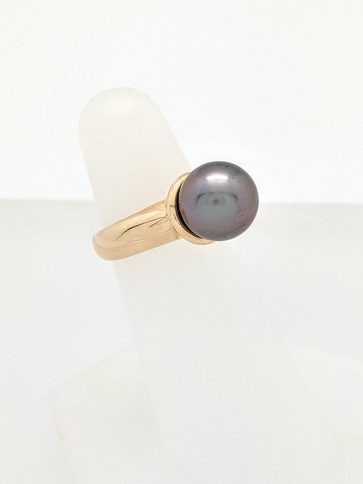  Ladies 14k Yellow Gold 10mm Tahitian Pearl Ring Size 5 5.4 Grams

You are viewing a Beautiful Ladies Tahitian Pearl Ring. This ring is crafted from 14k yellow gold and weighs 5.4 grams.  It features one (1) 10mm Tahitian pearl.  This ring is