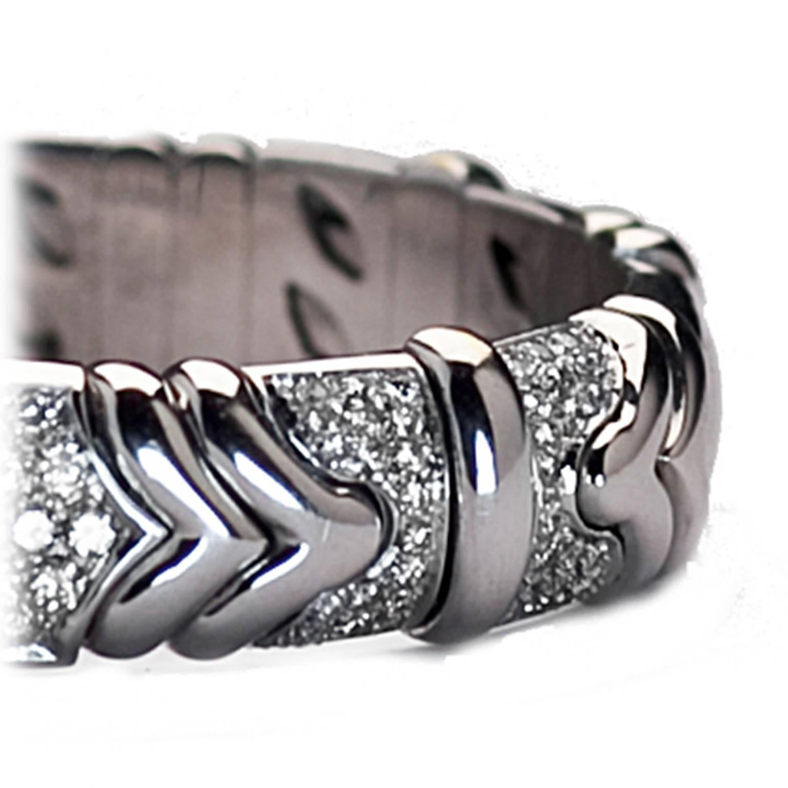 18k white gold bangle adorned with raised straight and chevron stripes and 3 carats of round-cut diamonds. Wear alone or stack it!!