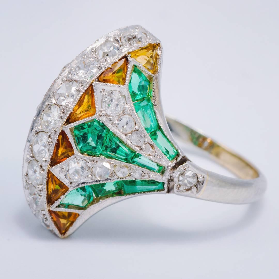 Amazing 1920's Art Deco Egyptian revival ring.... Just gorgeous and rare!
Diamonds, Emerald and Citrine set in Platinum. 
Size 4.5, can be sized.
The design composition of this ring is one of the most beautiful we have seen. Truly spectacular!
