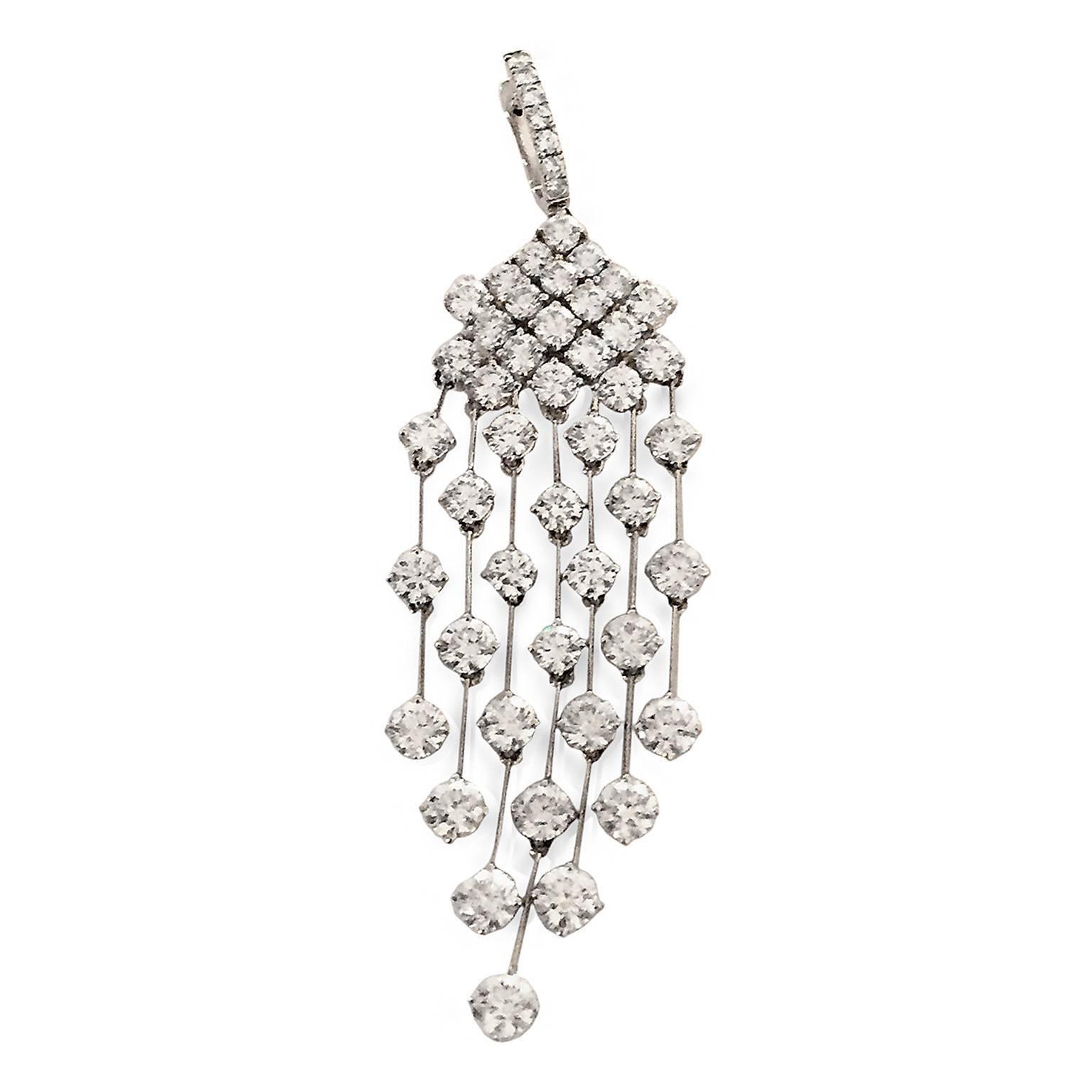 These are glamour at its best — 16.54 swaying carats of G-H color VS-VS2 grade round-cut diamonds, suspended in delicate gold bars of 18k white gold. Three inches long, and just under one inch wide.