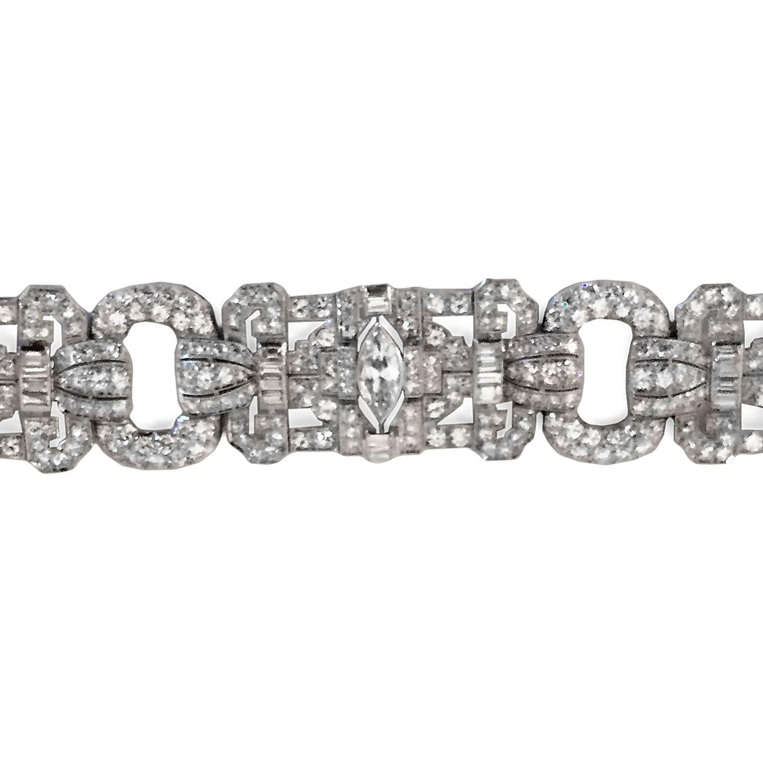 This original French Deco masterpiece features three large marquis-cut diamonds of 1.25 carats each, H color VS grade, surrounded by an additional 14 carats of diamonds. French jewelry maker's markings attest to authenticity. Definitely "Oscar