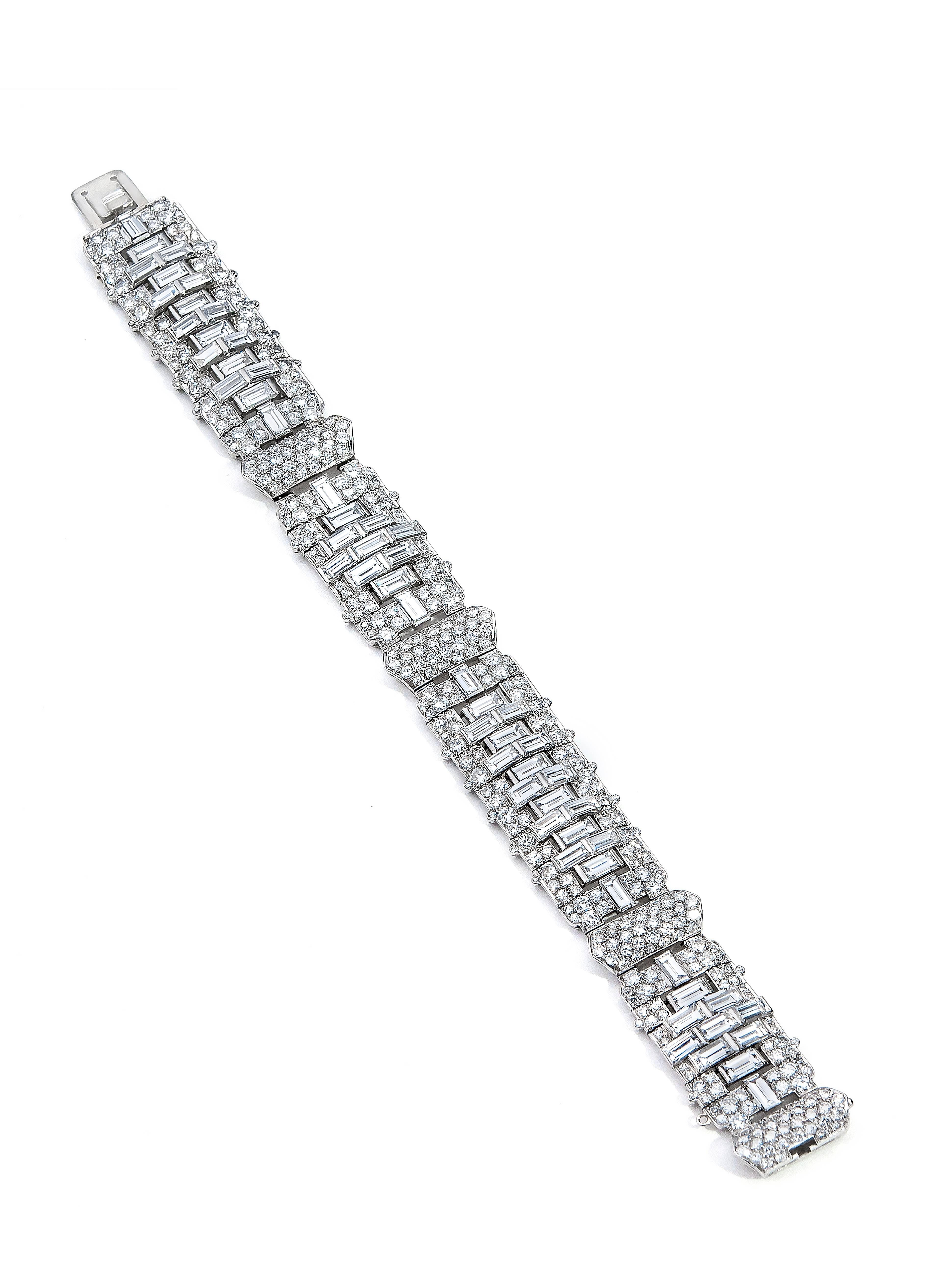 This bracelet is an original Art Deco piece with amazing quality and craftsmanship. In our opinion, it is one of the best examples of its kind that we have seen. The total weight of the diamonds is approximately 24.5 carats. This includes 58