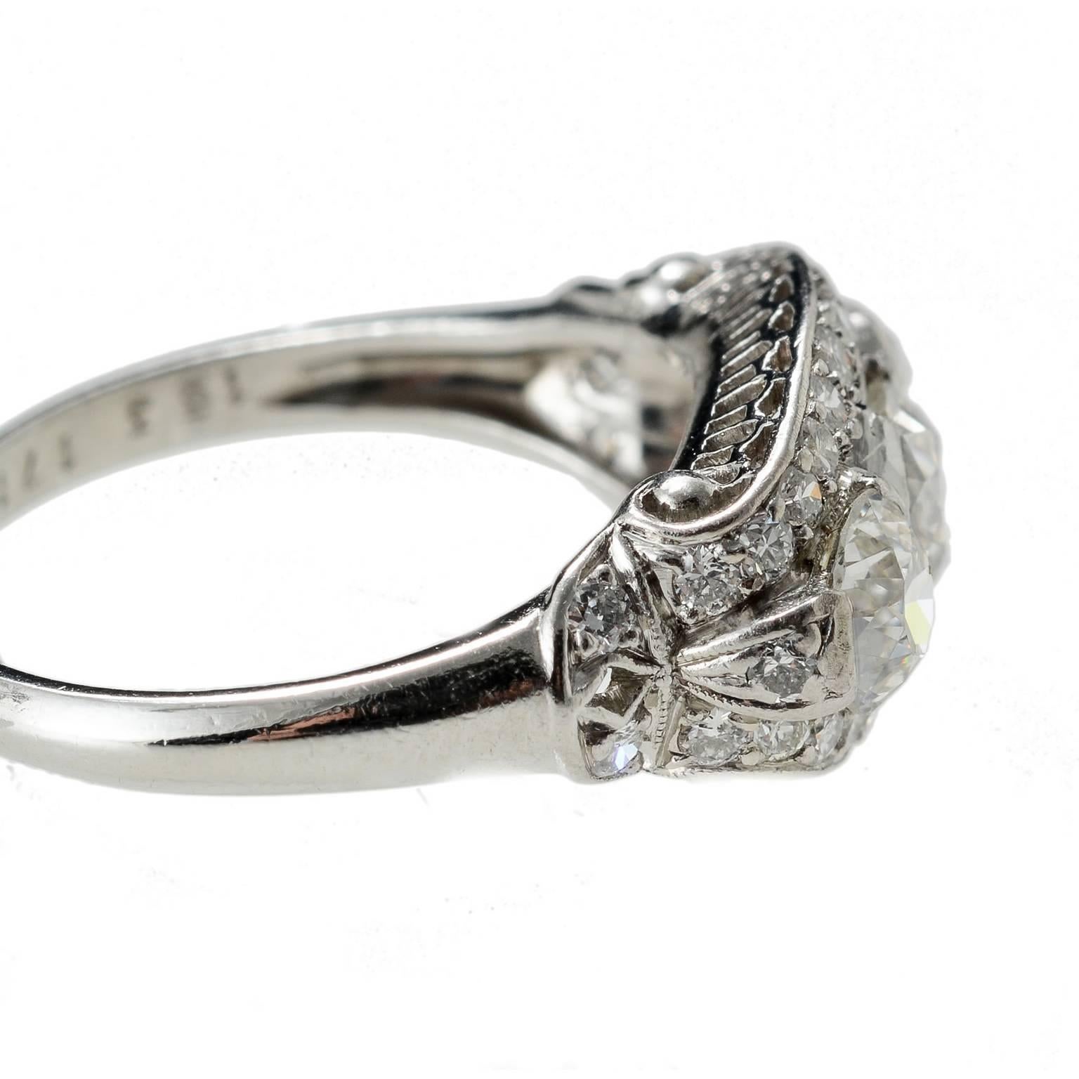 platinum set fine diamond three stone ring with diamond surround and shoulders very unique 1915c