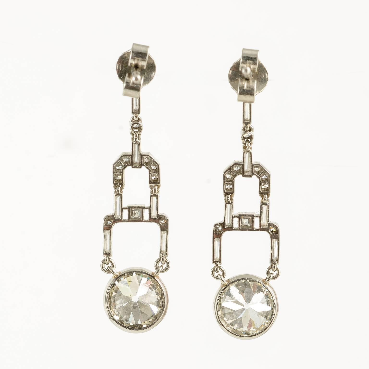 platinum set art deco diamond drop earrings with approx 2ct bottom drops on either earring 1920c