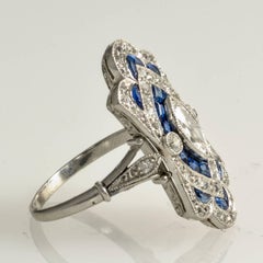 Art Deco Diamond and Calibre Sapphire Natural Marquese Platinum Ring, circa 1920