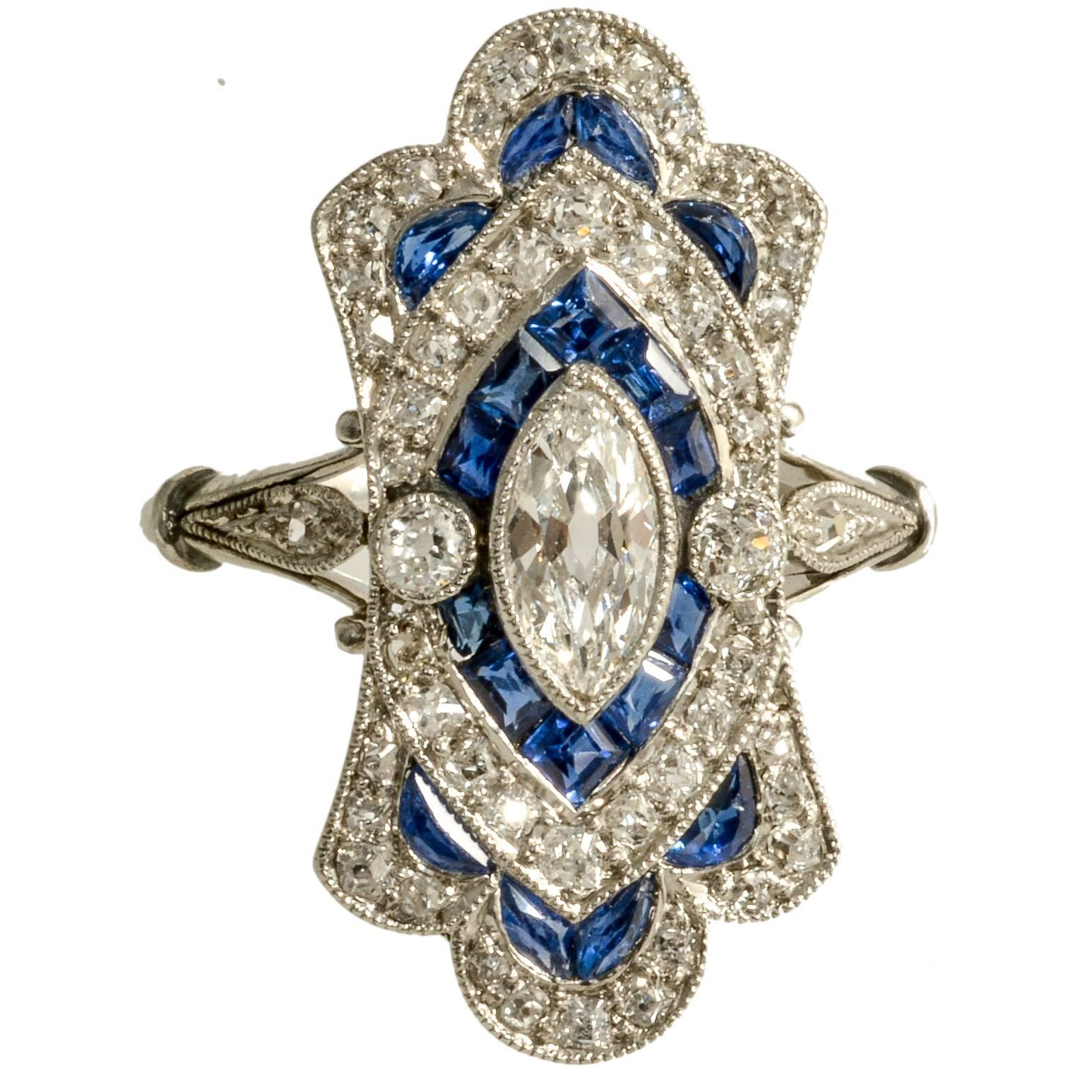 Art Deco Diamond and Calibre Sapphire Natural Marquese Platinum Ring, circa 1920 For Sale