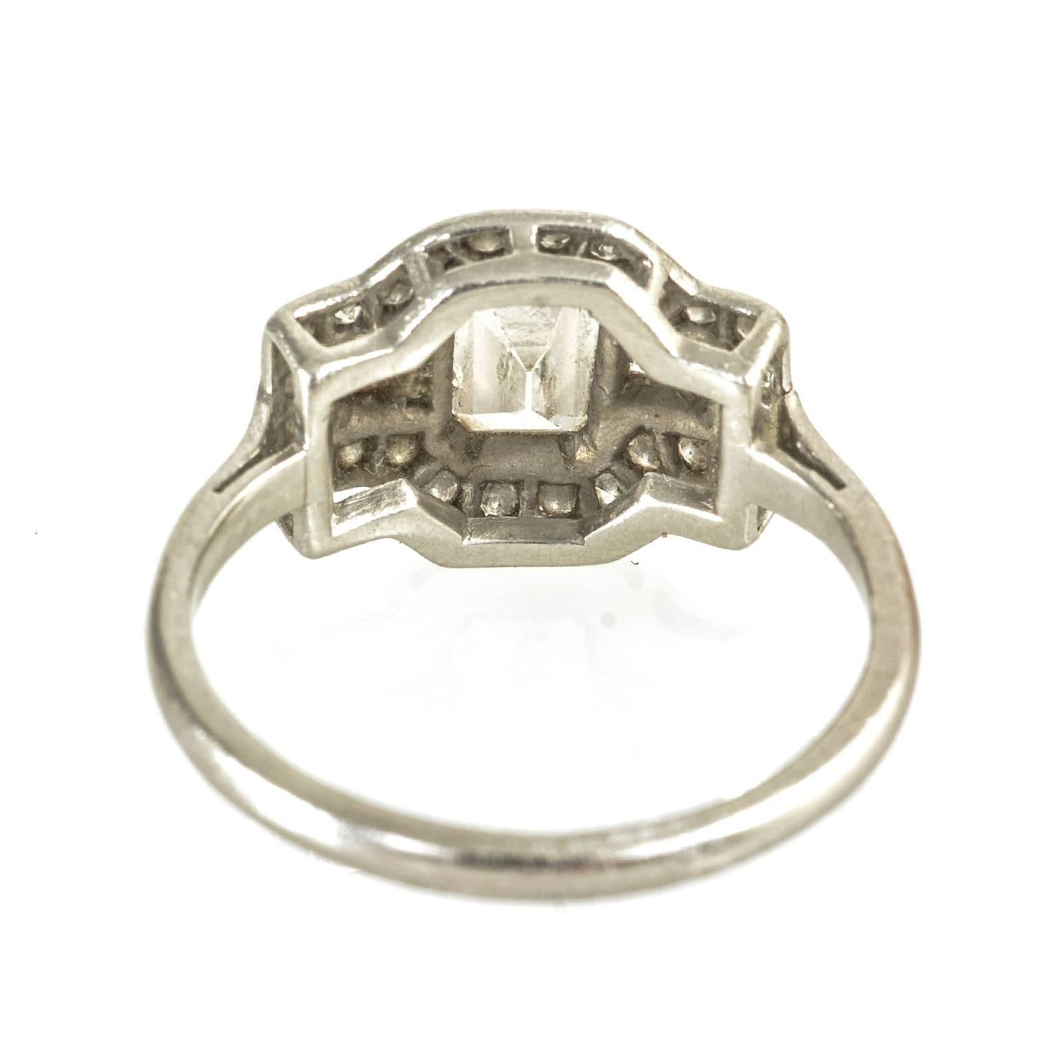 Art Deco Platinum Emerald Cut Diamond Baguette and Round Diamonds Ring In Excellent Condition For Sale In London, GB