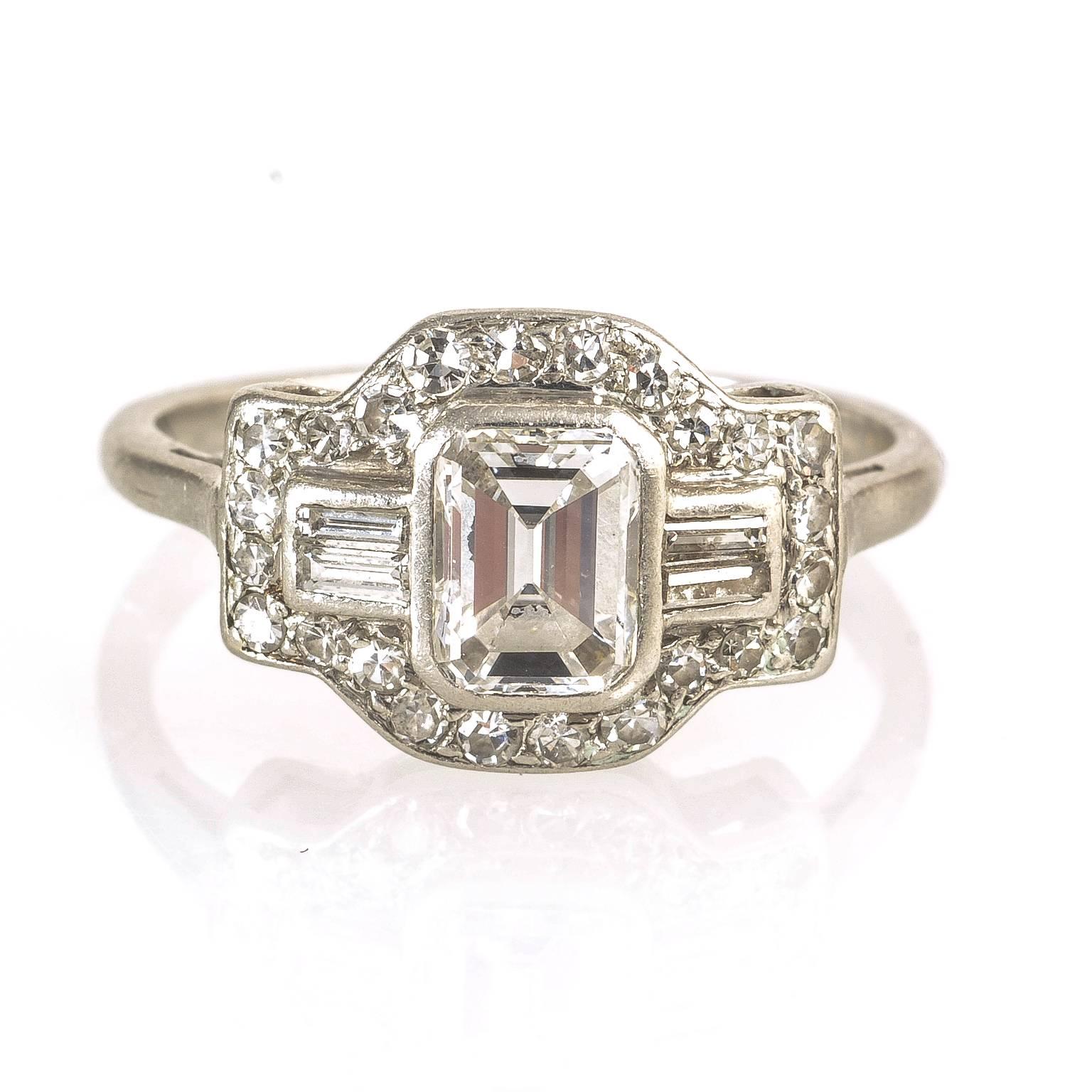 Women's Art Deco Platinum Emerald Cut Diamond Baguette and Round Diamonds Ring For Sale