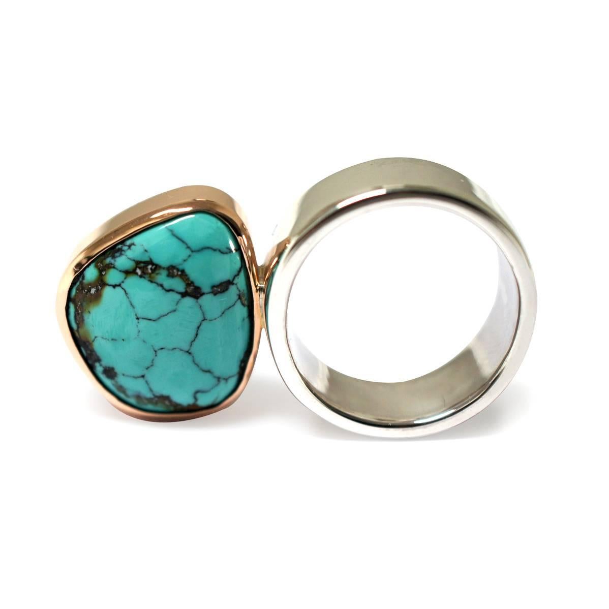 Handcrafted in Sydney, out of sterling silver and 9 karat rose gold, and set with a double-sided free form turquoise gem, this ring is a sculptural statement piece. This ring is a one-off piece, and only one is available.

Width of stone at widest