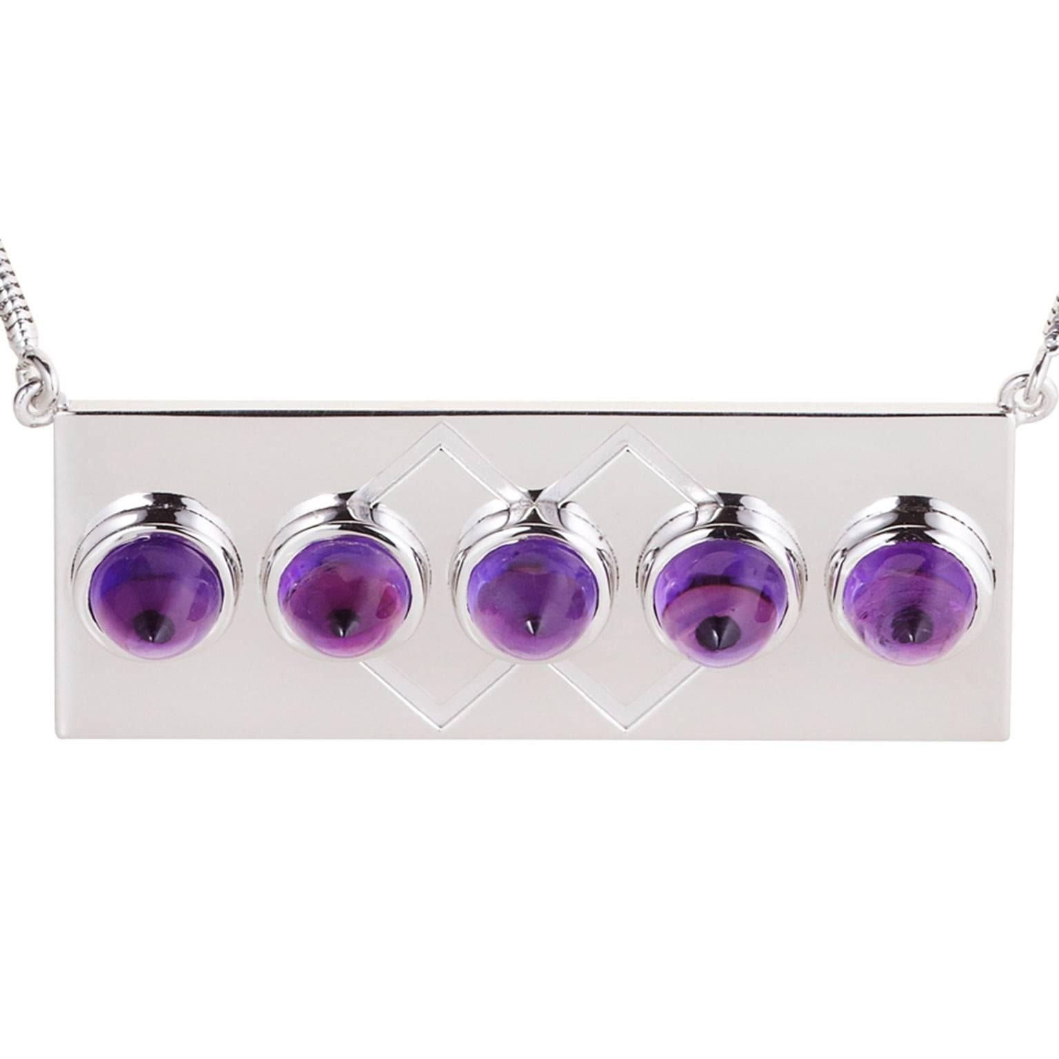 Crafted in sterling silver, and set with amethysts, this striking necklace was inspired by the Art Deco era and has a distinctly contemporary twist. Hand crafted in Sydney, this necklace is set with five bullet-shaped cabochon amethysts, and comes