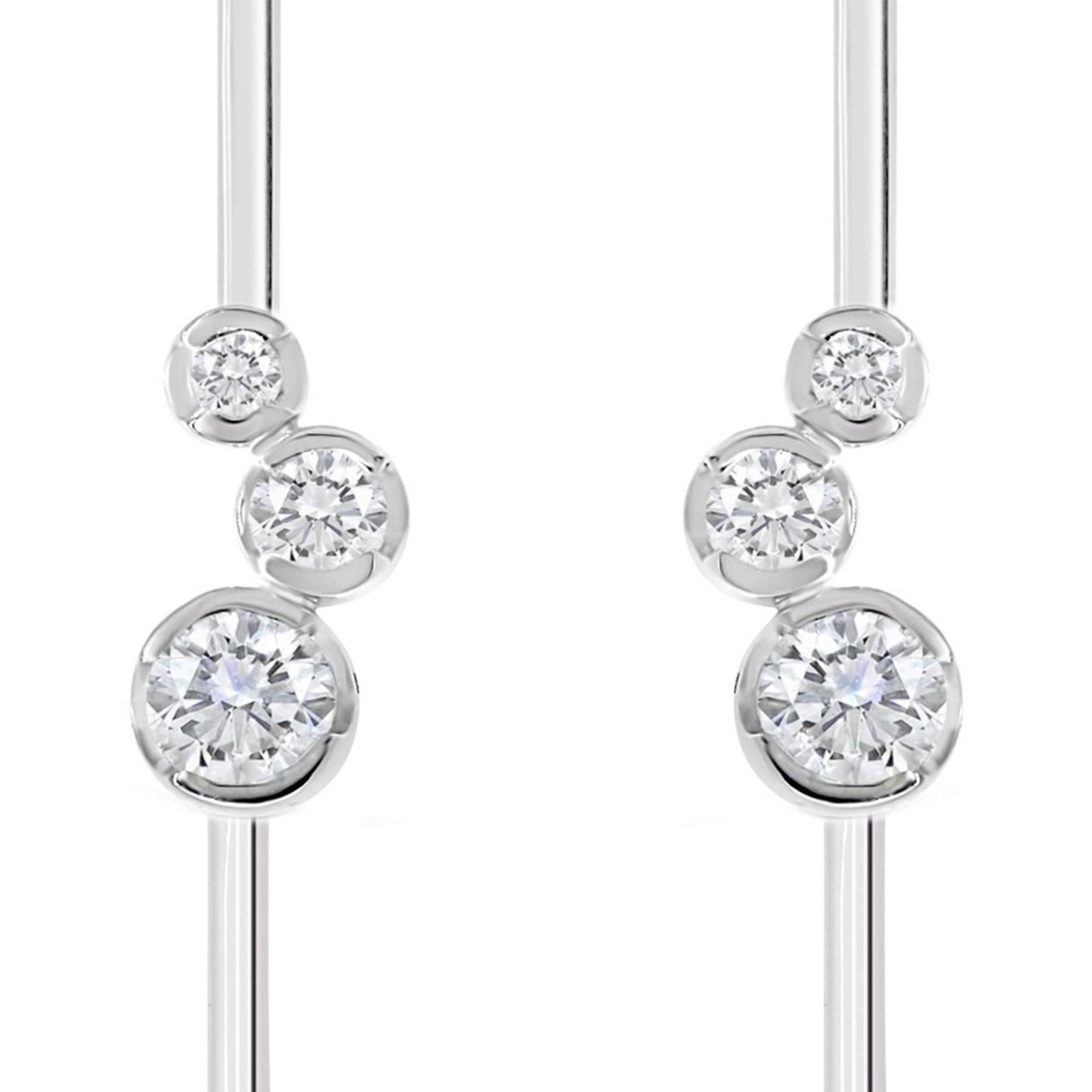 These elegant New York inspired diamond earrings are handcrafted in our Sydney studio, in 18 karat white gold. The clean, contemporary design coupled with top quality diamonds, gives these elegant earrings a sense of understated luxury. 

These