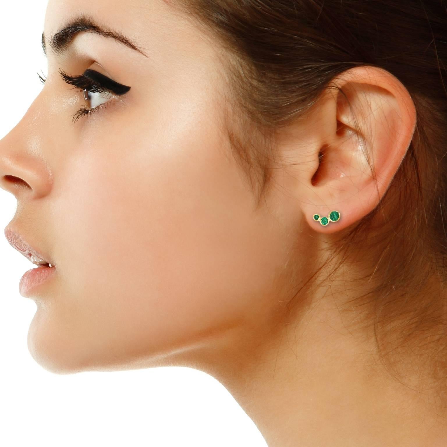 These gorgeous earrings feature six round Colombian emeralds (total carat weight 1.08 carat) set in 18 karat yellow gold. Handcrafted in our Sydney studios, these versatile earrings can be rotated on the ear and worn vertically or horizontally. The