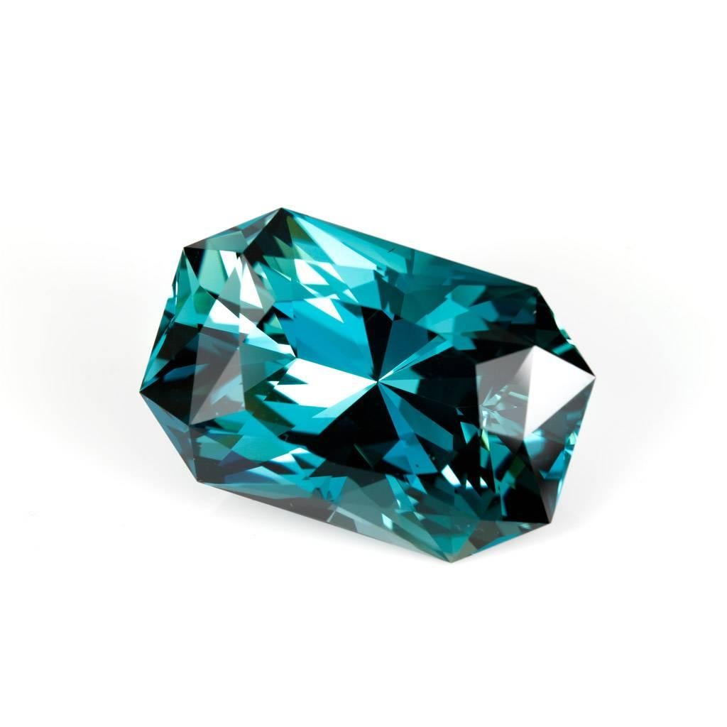 This stunning, one-of-a-kind, teal-coloured London Blue topaz is available to be set into a bespoke jewel by Lizunova Fine Jewels in Sydney, Australia. It was custom cut for us by the renowned master gem cutter Doug Menadue at Bespoke Gems in