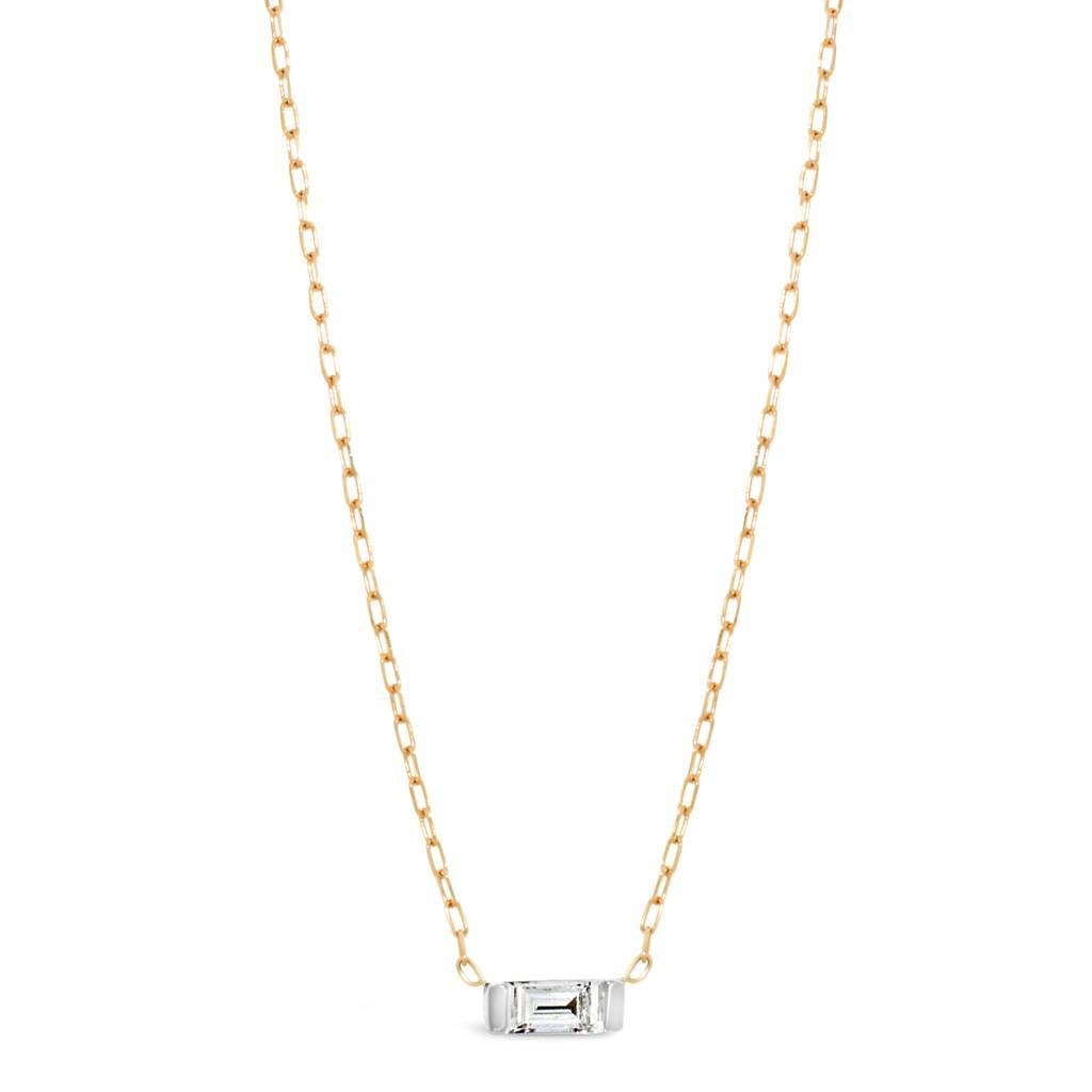 Handcrafted in 18 karat white gold, on a fine 18 karat rose gold chain, this elegant, delicate necklace features a sparkling baguette diamond, 0.21 carat F VS. Designed to sit in the nape of the wearer's neck, this necklace is sexy and