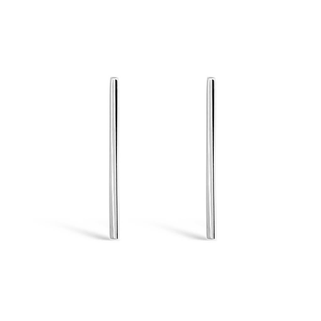 These minimalist, geometric earrings are sleek and easy to wear. The simple, beautiful design is very versatile, and can be dressed up or down. 

Length 25mm. 14 karat white gold. Hook earrings for pierced ears.

These earrings can be customised