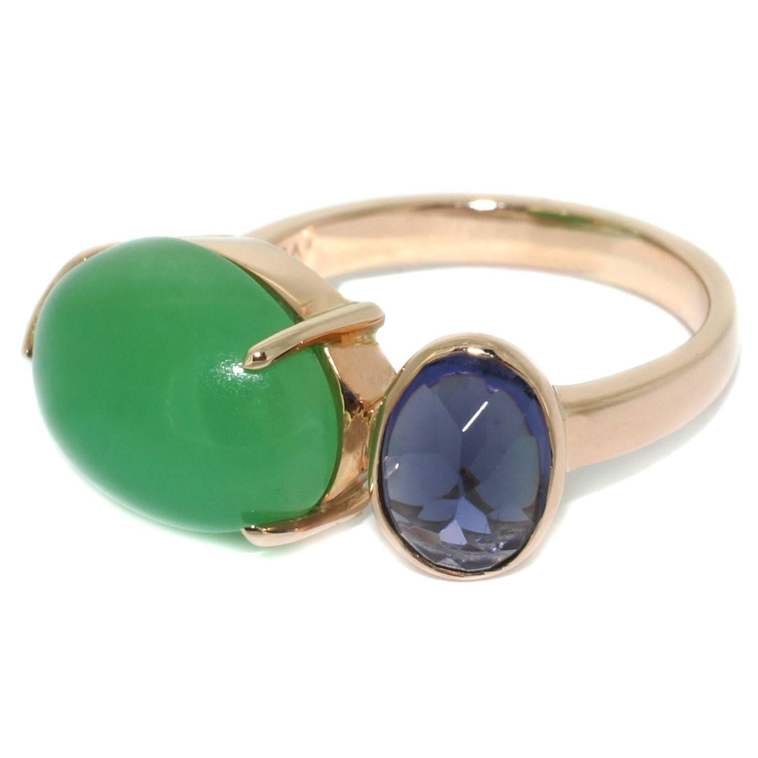 A gorgeous apple green chrysoprase is paired with a blue-purple iolite, also known as Viking stone, in this beautiful ring handmade in Sydney. The smooth surface of cabochon cut chrysoprase beautifully contrasts with the angular shape of the iolite,