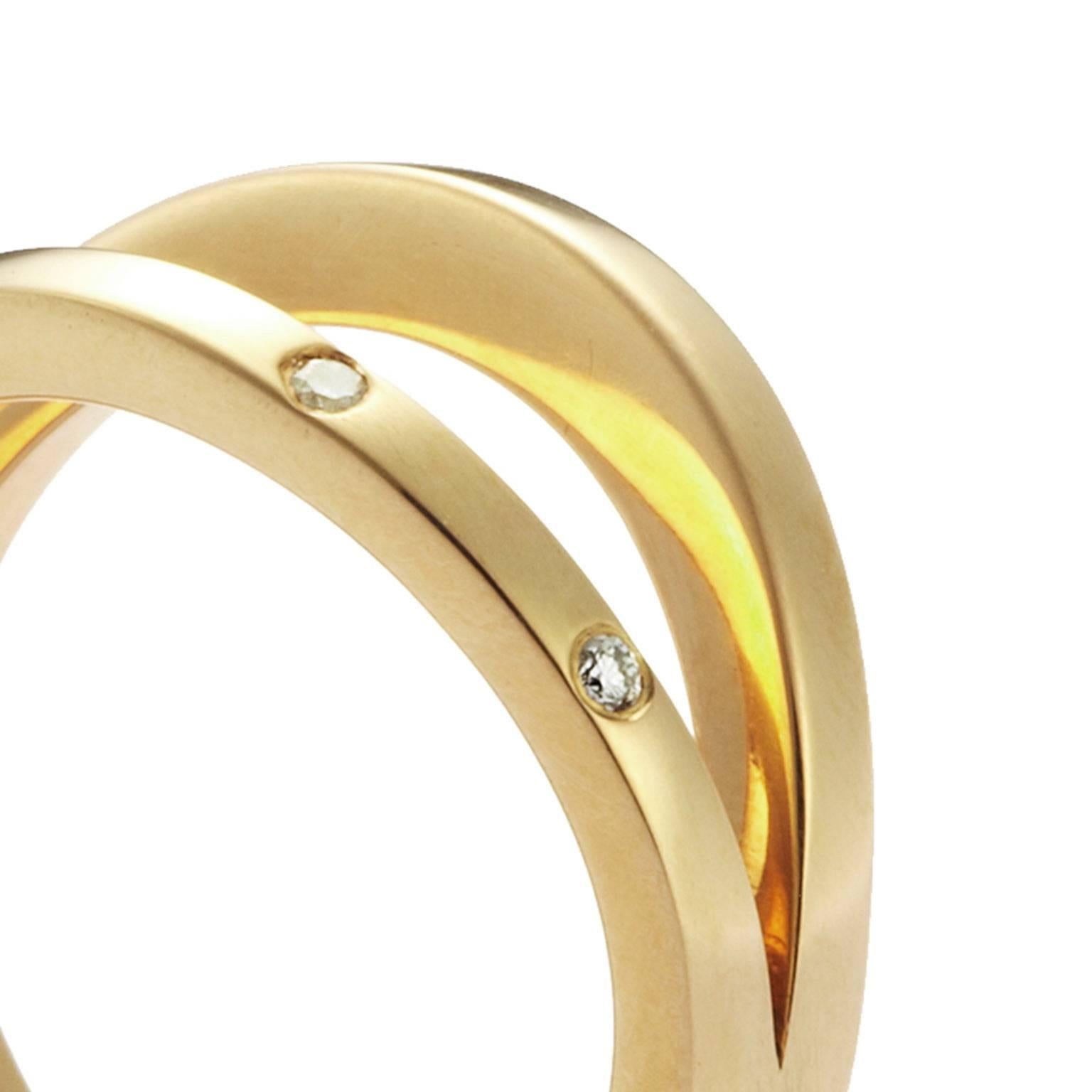 This simple and elegant ring symbolises the unity of two people in a relationship. This ring can be used as a commitment, alternative engagement or wedding ring. Handcrafted in our Sydney studios in 18 karat yellow gold, it is set with 2 brilliant