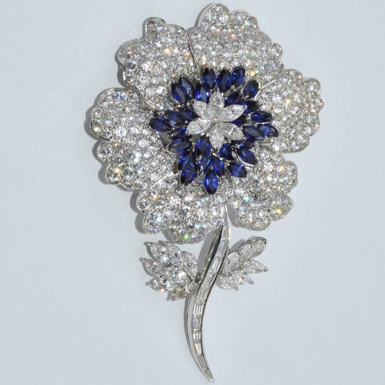 Set with approximately 20.00 carats of diamonds and 4.50 carats of sapphires. Platinum. Measuring 3 3/4 inches in length and 2 3/4 inches in width this impressive piece is a great addition to any collection. Circa 1963. 39.7grams.