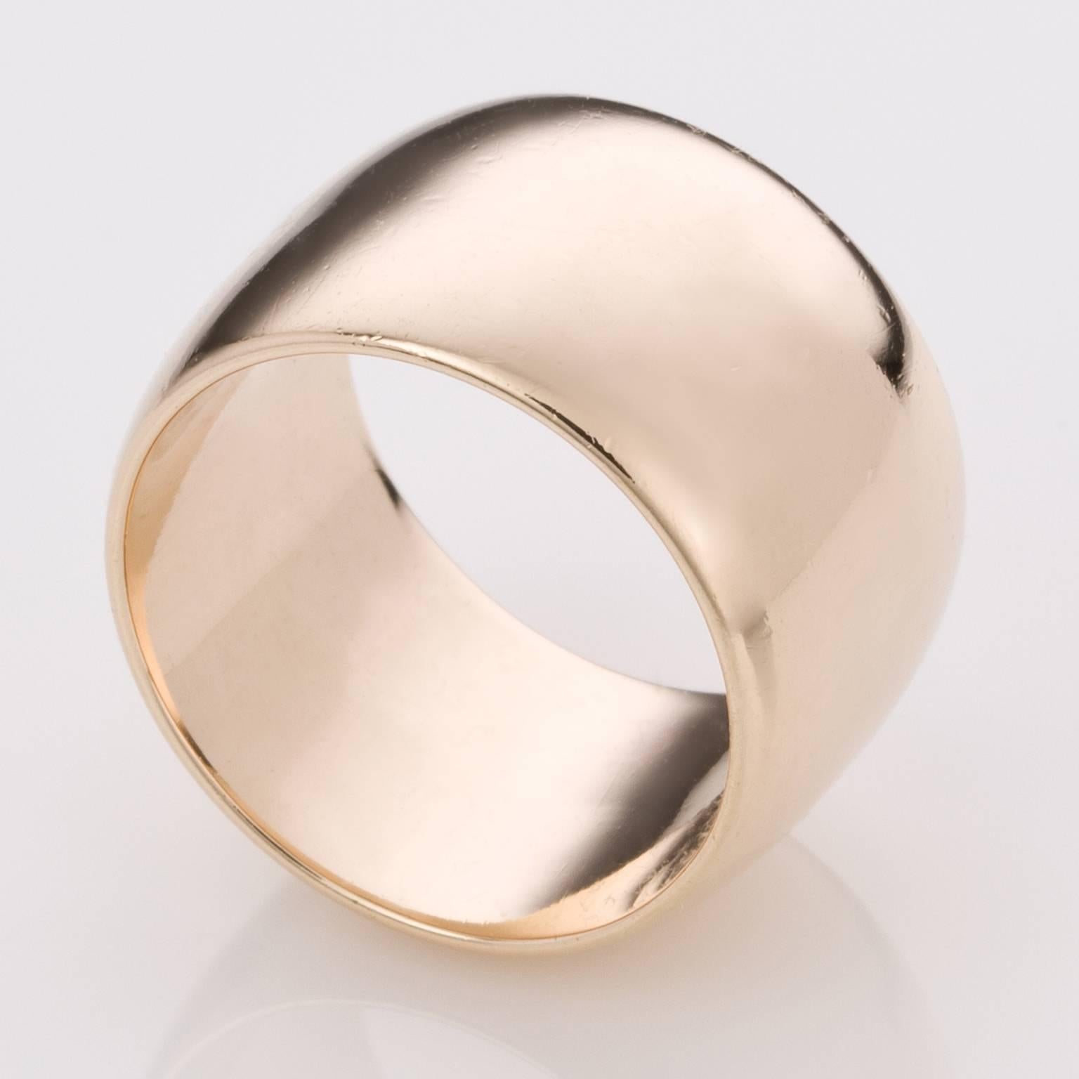 Simple and stylish, this lovely 18k yellow gold wide ring is so beautiful to wear either on its own or with some slender diamond bands either side. 
Either way, its a statement ring with a timeless appeal.  It has a slightly curved appearance and is