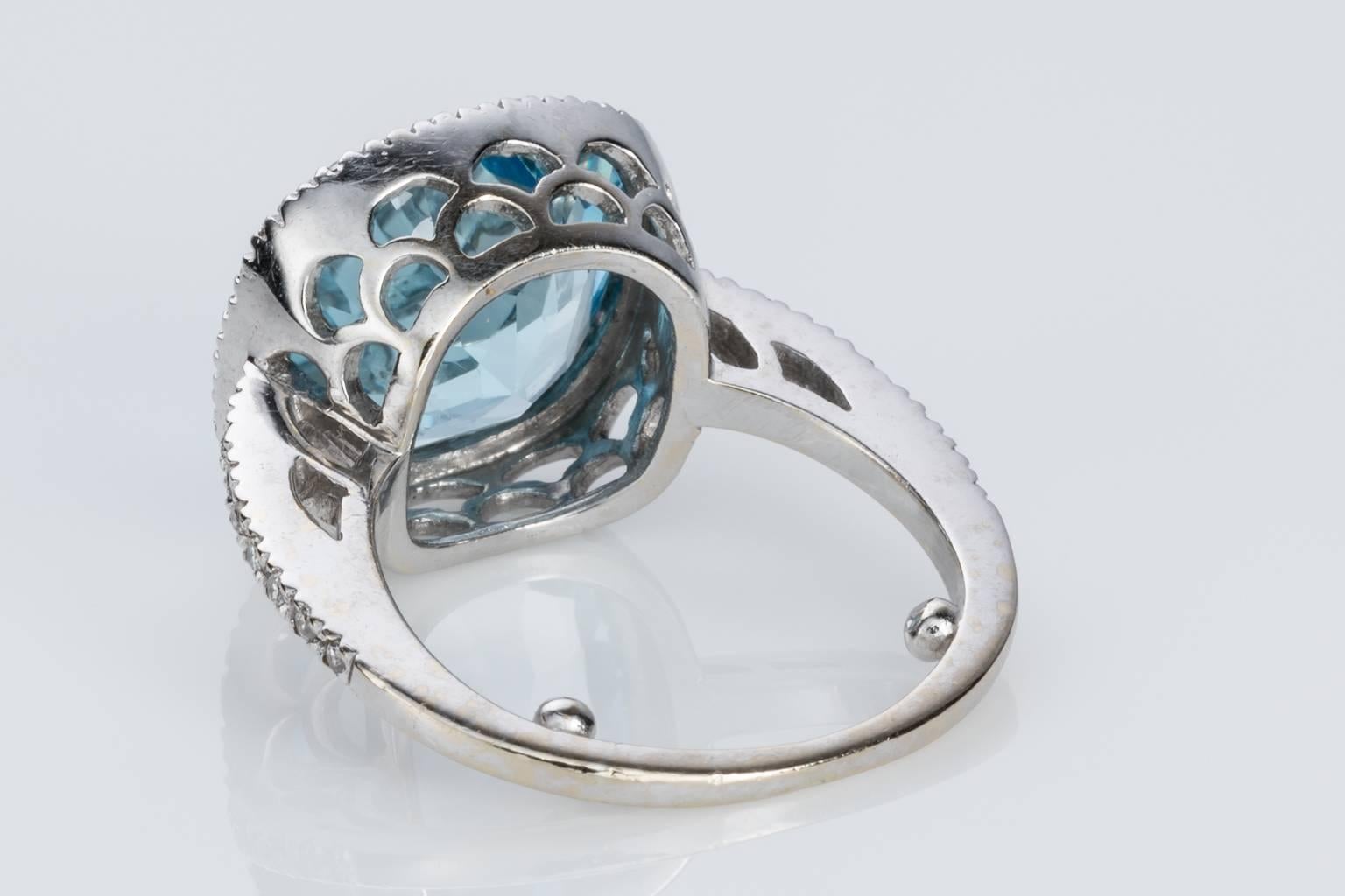 Women's Blue Topaz and Diamond 18 carat White Gold Halo Style Dress Ring