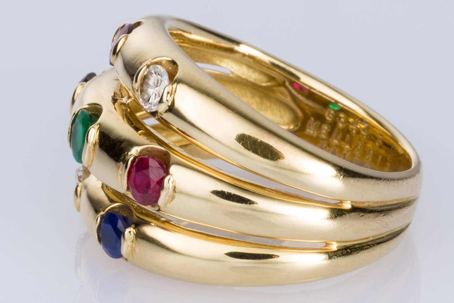 Mellerio Paris, a multi-gemstone 18k yellow gold ring consisting of three high domed bands, set with 2 x semi set diamonds total weight 0.16ct H colour, SI clarity, 2 x 2.80mm semi set rubies, 2 x 2.80mm semi set Ceylon type sapphires and 1 x 3.00mm