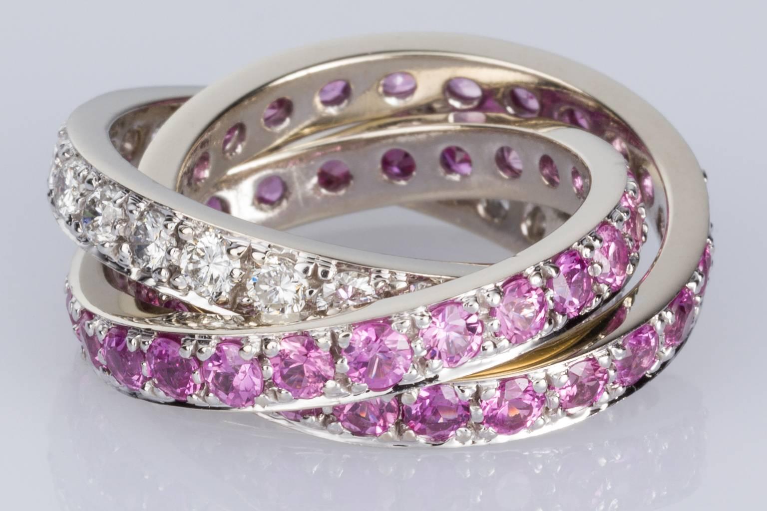 Round Cut Pink Sapphire and 1.32 carat White Diamond Three-Band Ring