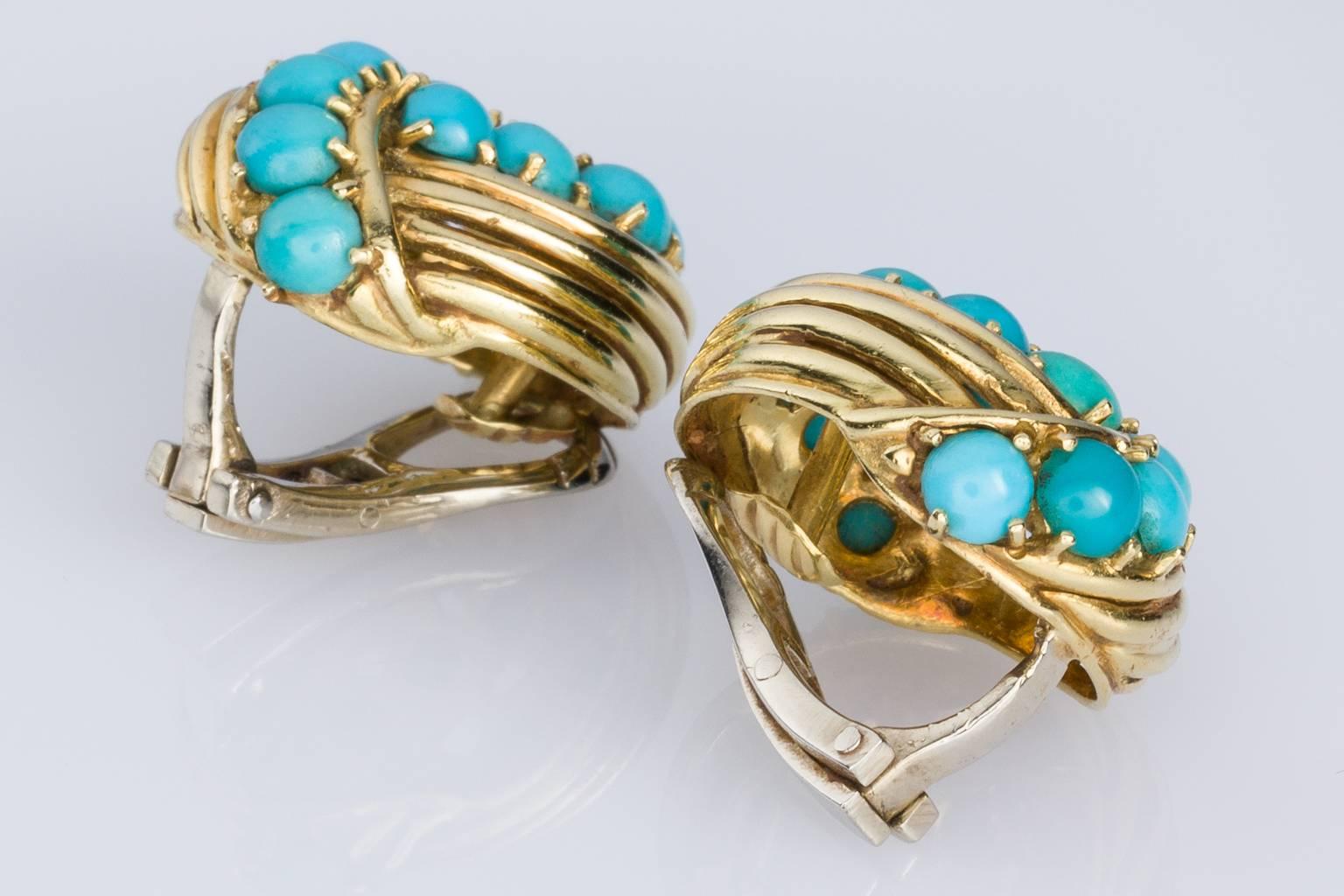 Striking and eye-catching these pretty Tiffany & Co Vintage earclips are each claw set with 12 blue-green turquoise beads measuring 3.5-4.00mm. Fashioned in 18k yellow gold, Signed Tiffany & Co - 18k, Italy. 
Stylish and sophisticated these earrings