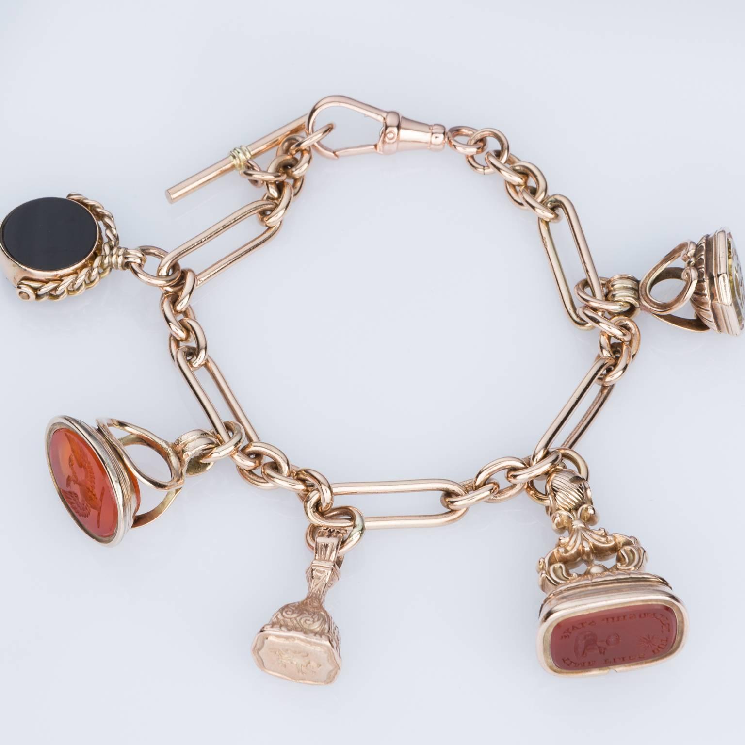 Looking for a piece that has some real history? Then this gorgeous bracelet is for you. A 9k rose gold paperclip link bracelet with T – bar & 5 vintage charms. Bracelet measures 20cm in length with attached swivel clasp.
Charms consist of:
1 x Onyx/