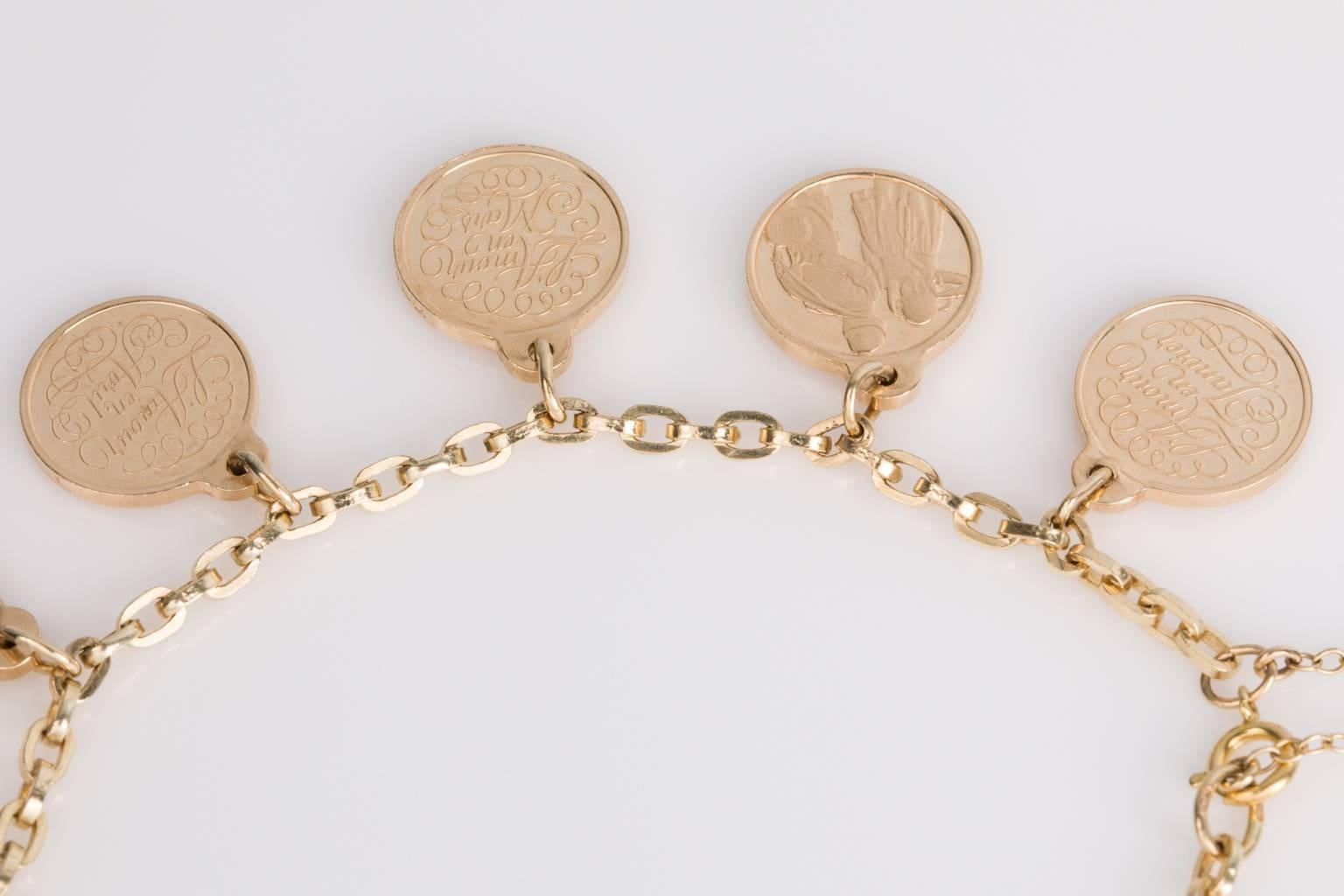 How beautiful is this idea? Each charm represents a month, given to the love of your life to show your undying love for them, so romantic. 
With a 14k yellow gold belcher link chain bracelet adorned with 12 "Love" Charms written in French.
