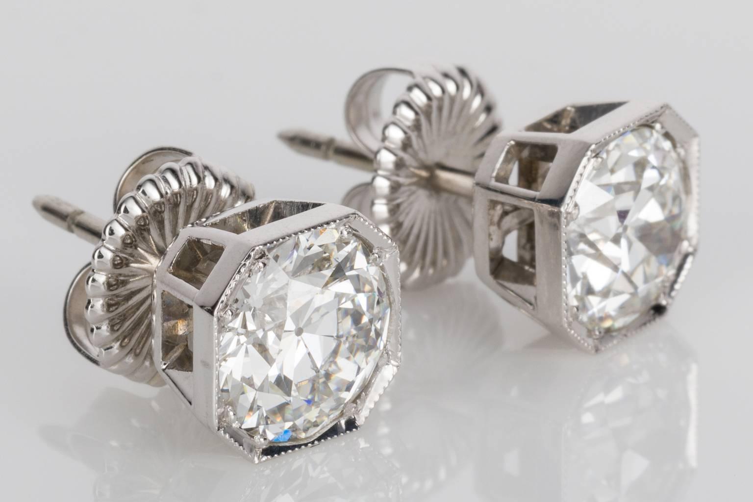 Fabulous, elegant and will be noticed! 4.25ct total diamond studs that are a total knockout. You don't often see bright white old cut diamonds like these. Set in 18k white gold hexagonal shape settings with millegrain detailing on each earring. The
