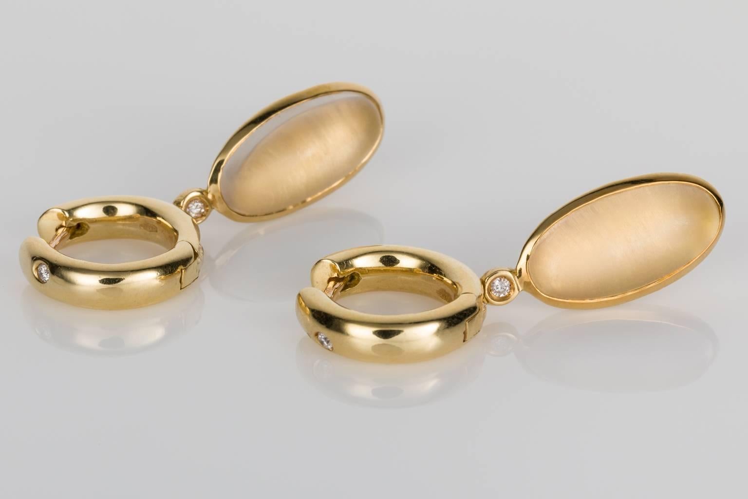 Such a delightful pair of earrings that would suit any occasion. H Stern the Brazilian jewellery designer who is synonymous with classic style and elegance. This pair of earrings has an oval shaped cabochon quartz crystal layered over 18k yellow