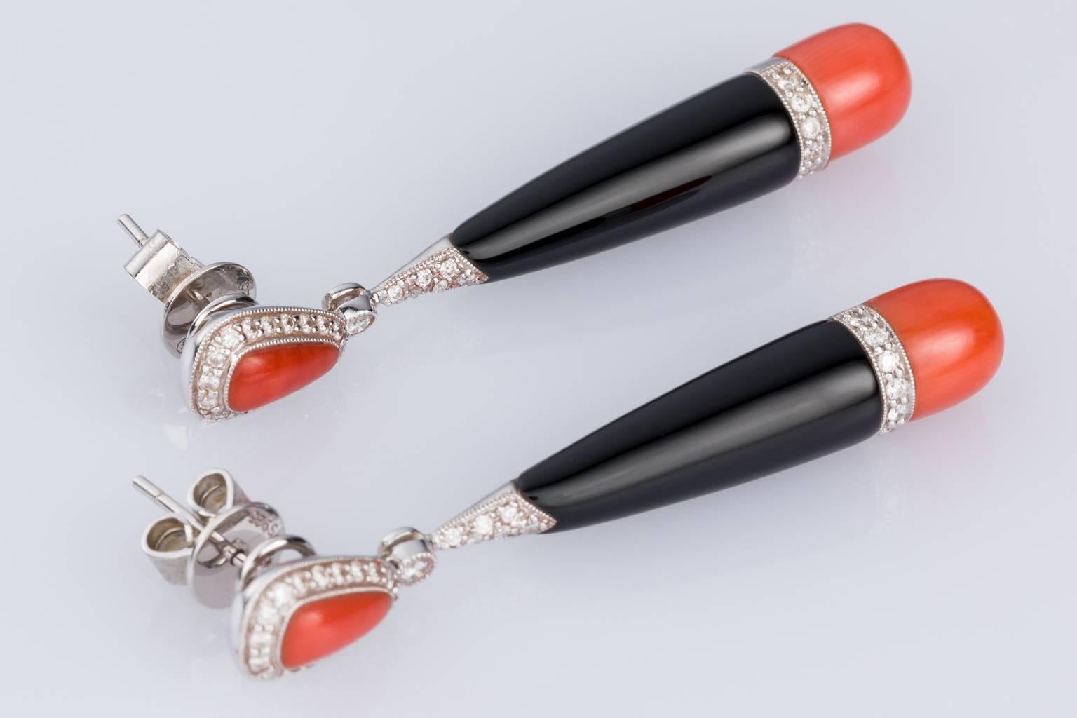 Fabulous for day or night these earrings convert so you can wear them both ways. For day time just wear the coral and diamond stud section of the earrings, understated elegance. For the night time add the beautiful Onyx, coral and diamond drop