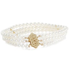 Triple Strand Freshwater Pearl Bracelet with 14 Carat Yellow Gold