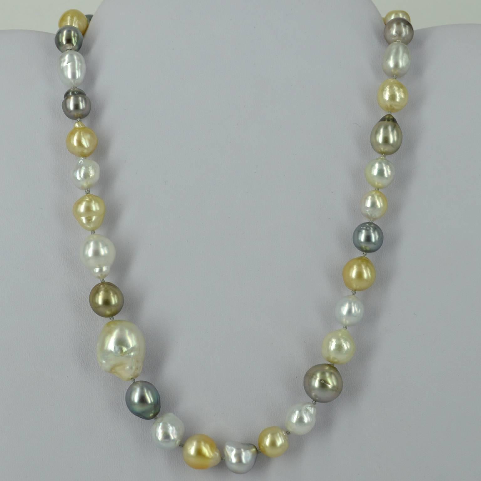 Necklace features a mix of Cream, White, Grey and Golden tone South Sea and Tahitian Pearls beautifully hand knotted on soft grey thread. Pearls range from 9.3x9.9mm to a huge feature 20x16.2mm Golden South Sea Pearl. Pearls are natural and not